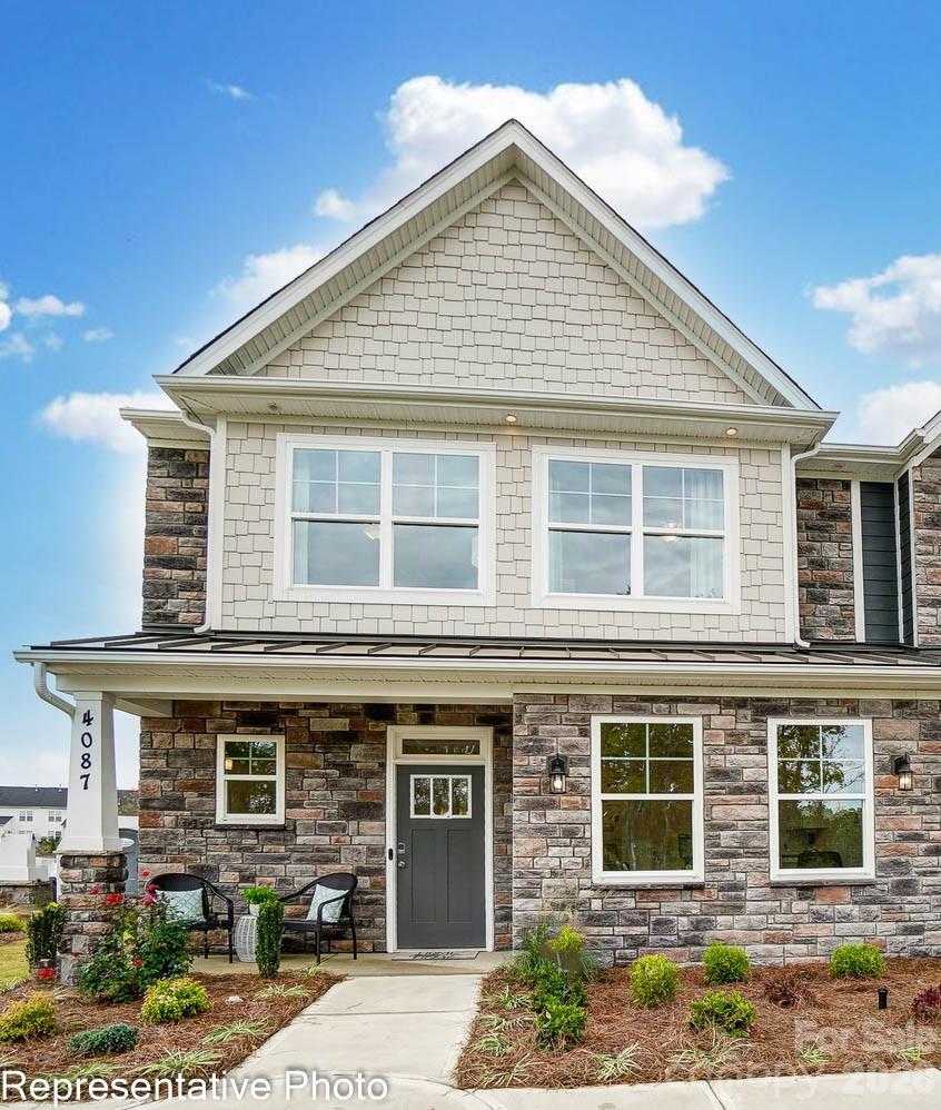 New townhomes in Harrisburg! This end-unit townhome features the primary suite on the main and a flex/bonus room on the upper floor. The home has a total of 3 bedrooms, 2.5 baths, and more than 1,900 square feet of living space. The kitchen features quartz counters, Shaker-style white cabinets, a tile backsplash, and stainless appliances, including a gas range. The open dining area and 2-story great room look out to the rear covered porch. The primary bedroom features a tray ceiling, and the primary bath features a tiled shower with bench seat and a double-sink vanity. The upper floor has a loft overlooking the great room, two additional bedrooms, a full bath, and a finished flex space/bonus room. Other extras include a tray ceiling in the foyer, white cabinets & quartz counters in all baths, and stairs with composite treads & metal balusters. Community amenities include a dog park, walking trails, a playground, outdoor pool, and cabana.