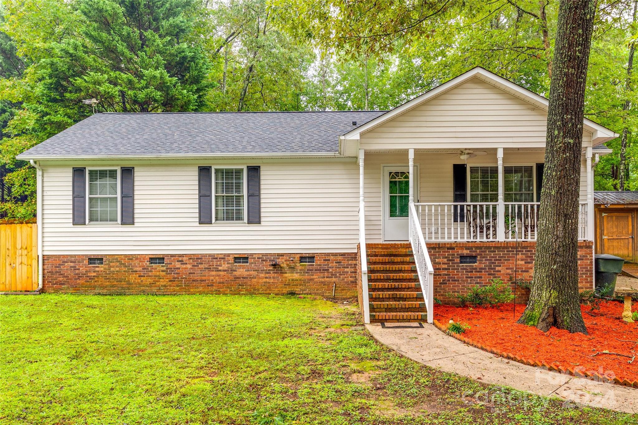 Discover the charm of this delightful ranch home, nestled in a serene and well-established neighborhood just minutes from the center of York. The inviting living room boasts high ceilings that create a spacious, open ambiance, seamlessly connecting to the kitchen and dining areas. Each room is generously sized with plenty of storage, ensuring comfort and convenience. The primary bedroom stands out with its impressive size and attached bathroom featuring a beautifully tiled walk-in shower. Enjoy your private backyard retreat, complete with a newly fenced yard, a deck perfect for entertaining, and a relaxing hot tub. Additionally, the property includes two detached sheds, one equipped with electricity. The mature lot offers a blend of beauty and privacy. Welcome Home!
