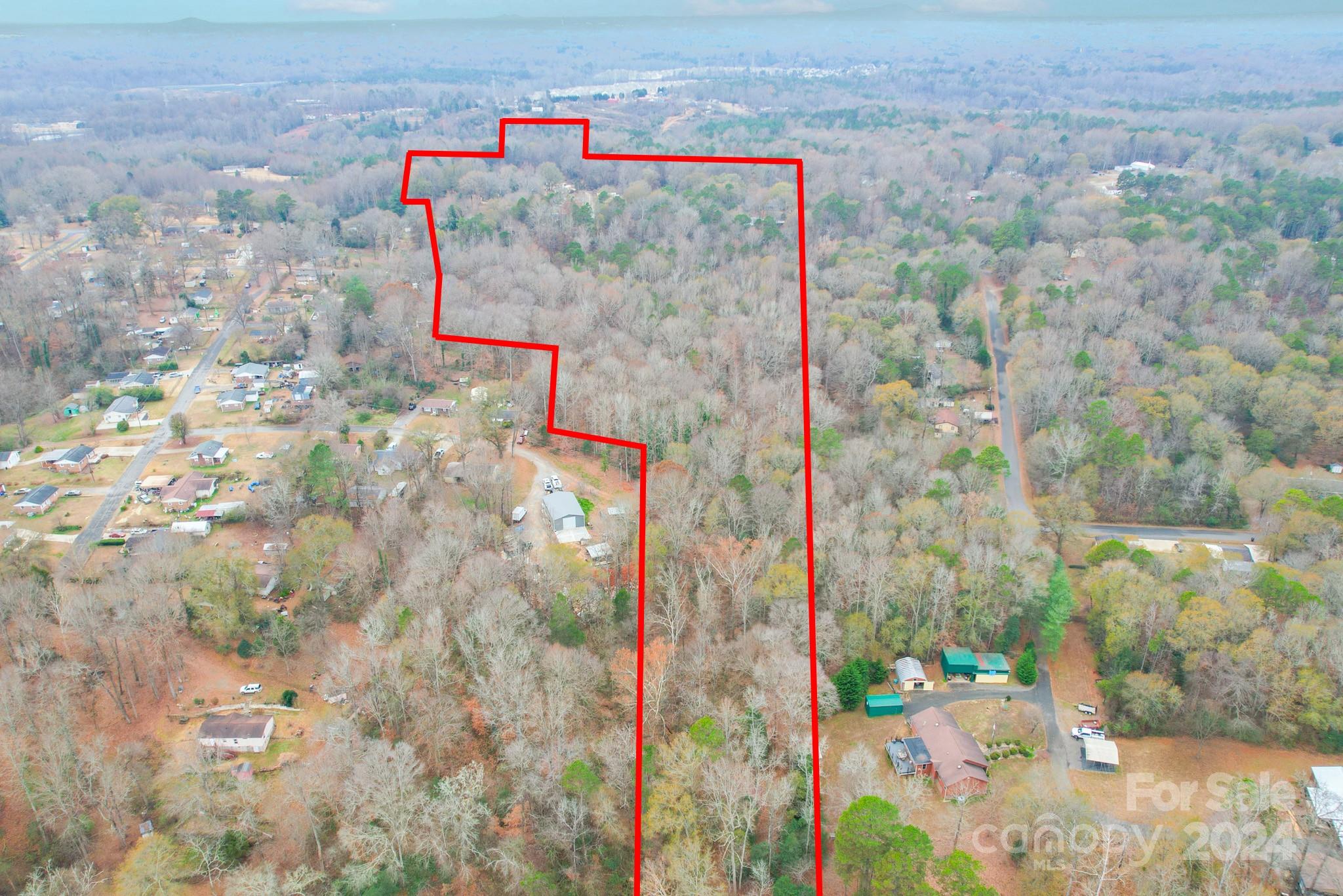Gorgeous parcel of Riverfront land with over 100' of frontage on the South Fork of the Catawba River! Ready for development, or build your own private estate in the growing area of Dallas, NC. This plot of land offers 3 different access points, and endless opportunities. It has previously been approved for a 4 Bedroom home with a perc test, and there is a community well currently on the adjacent property with deeded access - or install your own well. Loaded with old growth hardwoods and beautiful topography.