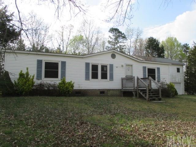 Iron Station - 3BR/2BA 1309 sq ft manufactured double wide on .73 acres. Large den area open to dining. Detached 2-car garage with extra storage room. Upstairs of garage is an apartment with 1BR/1BA (649 sq ft) and a small kitchenette. Deck on the back of the double wide. This is a Fannie Mae HomePath property. Lots of potential.