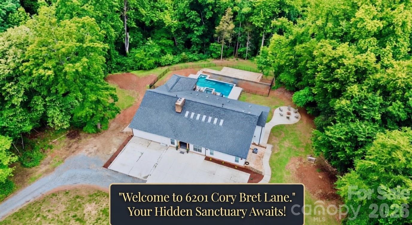 Discover your own hidden sanctuary—you won't believe where this home is sitting! Tucked away in complete privacy with no HOA, this fully updated luxury estate offers the ultimate retreat, ready for your personal touches and immediate move-in. Just minutes from highways, shopping, and dining, the home has been completely reimagined from top to bottom with a dramatic vaulted ceiling and wet bar perfect for entertaining upon entry, expansive living spaces, modern finishes, and effortless flow. The interior has been fully refreshed with new everything: both gourmet kitchens feature quartz counters, custom cabinetry, and islands—the main kitchen is outfitted with two sinks, a pot filler, and a generously sized pantry; all six bedrooms updated with fresh paint, new flooring, and designer lighting; and all six bathrooms upgraded with new fixtures and elegant vanities, including an expansive steam shower in the primary suite. Upstairs awaits a loft area and walk-in attic for storage. The main level includes two expansive living areas providing versatile options for gatherings. Ample storage throughout, plus a basement with rear-facing garage access, keeps everything organized. With six bedrooms (septic approved for four), this property adapts seamlessly to your lifestyle—the basement can be configured as a second living quarters with its own kitchen, laundry room, living room, dining room, and two bedrooms with two full baths. Outside, enjoy an expansive pool surrounded by lush privacy landscaping and a brand-new partially covered back deck that extends your living space outdoors. Recently fully resided and painted in April 2026, with a poured pad awaiting garage completion to finish the circle driveway. Every square foot reflects thoughtful updates for turnkey luxury living. Schedule your private showing today.