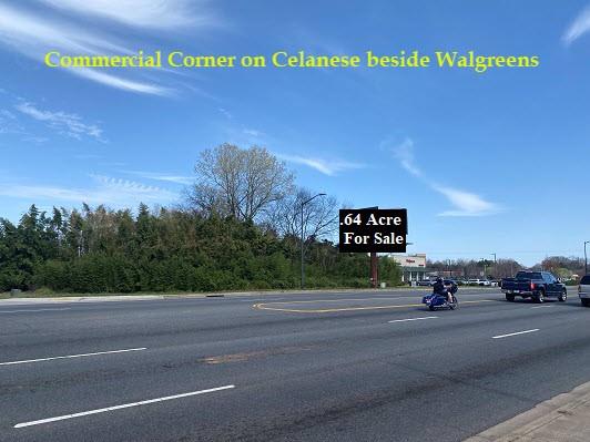 Very high visible commercial corner on a seven lane highway directly beside a Walgreens drug store.