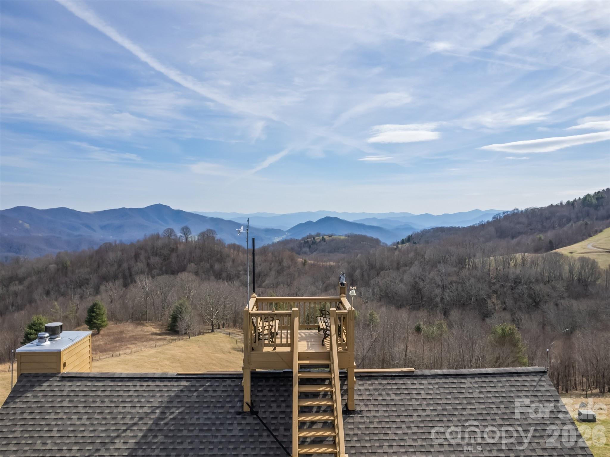 Stunning long-range views in every direction make this 15-acre mountain retreat feel like you’re on top of the world. Indescribable sunrises and sunsets. Mostly cleared and gently rolling, the property offers two additional excellent home sites, providing exceptional flexibility for expansion, guest homes, or investment opportunities. Elevations range from 4,100 to 4,500 feet, delivering cool mountain breezes, peaceful privacy, and abundant wildlife—where hawks soar and nature surrounds you. ***The impeccably maintained main home features recently painted cedar siding and a 2025 roof, blending mountain charm with thoughtful updates. Inside, the main-level living area centers around a dramatic two-story great room with walls of windows, hardwood floors, and a stone-faced wood-burning fireplace. The open kitchen includes an island, breakfast bar, and dining area—perfect for entertaining while enjoying the breathtaking views. The main level also offers two bedrooms, two baths, and laundry, making everyday living convenient and comfortable. ***Step outside onto the wraparound deck or climb to the unique crow’s nest landing for even more spectacular scenery and perfectly private silence. This home truly brings the outdoors in, with views from nearly every room. ***The lower level features a private apartment with both interior and exterior entrances, kitchenette, and Quadra-Fire wood stove, ideal for guests, or multi-generational living. Additional features include: all furniture, a 26-foot-long one-car garage with space for a vehicle and mower, attic access with steps and lighting for extra storage, and propane lines already in place for the range and fireplace, with an owned 500-gallon propane tank. HOA: road maintenance only as needed ($100 in 2025). Portion of parcel # 8724-96-5006.