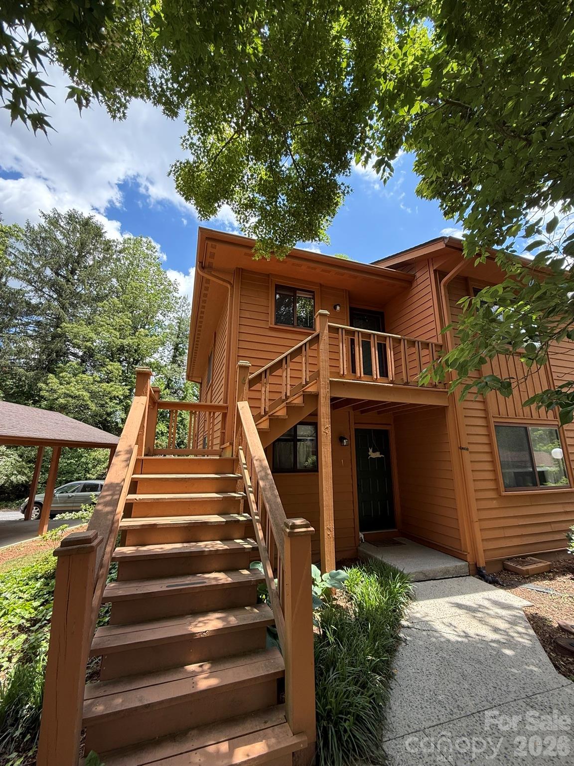 There's something special about a home that just feels right the moment you step inside. This upper-level end unit has that quality in abundance — warm, bright, and thoughtfully updated, tucked at the furthest corner of the community where the only sounds you'll hear are the ones you choose to let in.

Situated on a quiet cul-de-sac, the setting offers a sense of privacy that's genuinely hard to find at this price point. Yet you're never far from the action: downtown is just a mile away, with its restaurants, coffee shops, and weekend farmers markets all within easy reach. And with the beloved new Ecusta Trail practically at your doorstep, your next morning walk, jog, or bike ride is always waiting for you.