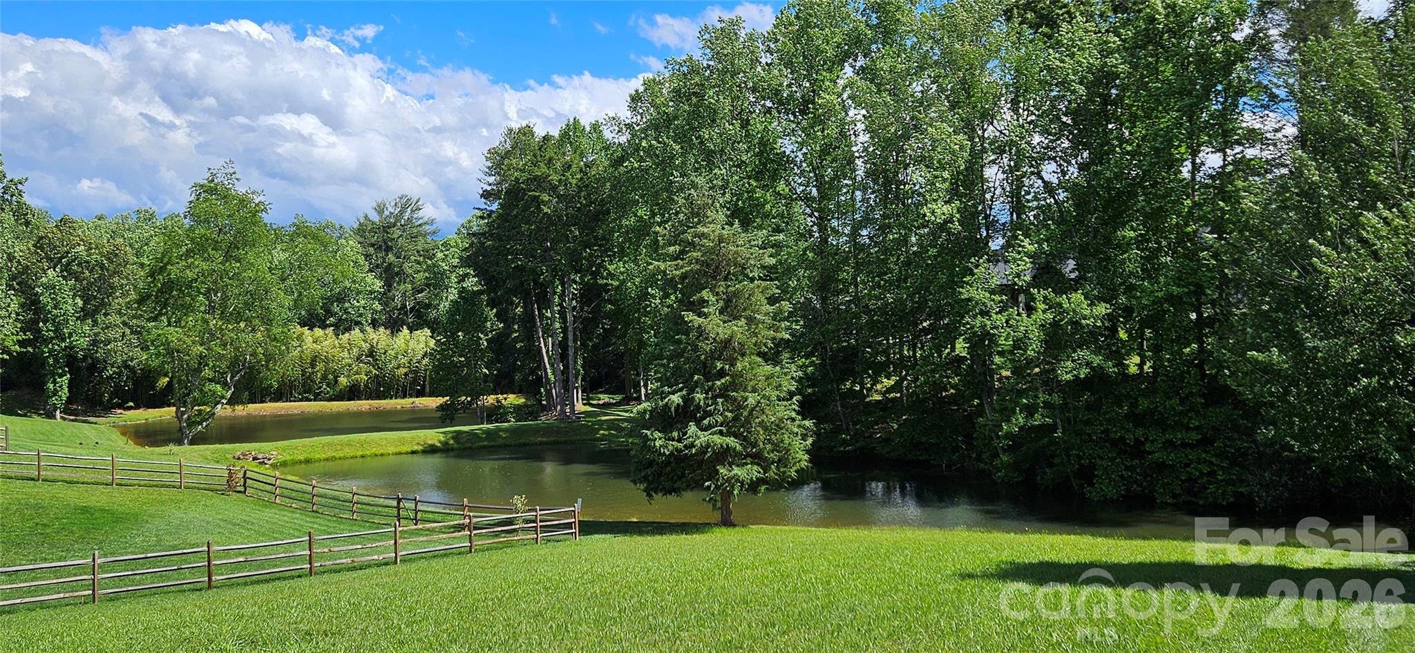 Discover the perfect setting for your dream home in this exclusive gated community featuring only 36 homesites. This cleared homesite offers natural gas, city water, underground utilities, and a septic permit already in place, making it ready for your vision. Enjoy the beauty and tranquility of two stocked ponds, creating a peaceful backdrop and a unique neighborhood amenity. Experience the privacy of a small community with the convenience of modern utilities already available. One of the last remaining waterfront lots in the neighborhood.