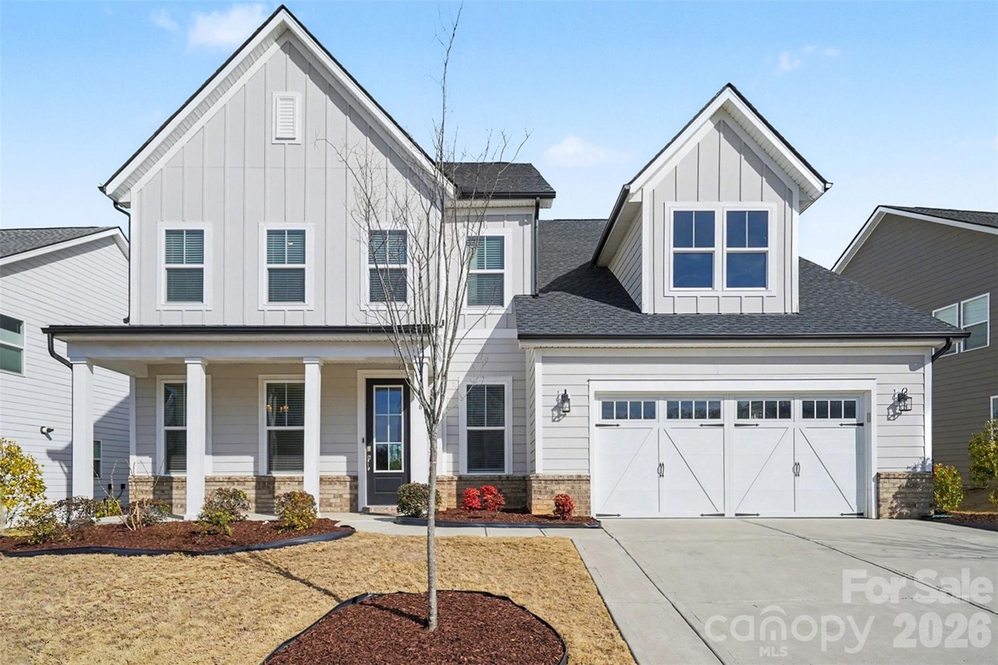 WATCH VIDEO TOUR!! Beautifully Spacious 5-Bed, 4.5-Bath Home with Main-Level In-Law Suite – Just Minutes from Ballantyne! This luxury craftsman style home resides in the highly desirable Ridgecrest community with an outdoor pool for summertime family fun. As you enter, you'll pass a home office with full glass French doors on the left. Continue into the open living, kitchen & dining area flooded with natural light from the abundance of windows. Gourmet kitchen boasts stainless steel appliances, an oversized island with breakfast bar seating, and a built-in wine cooler in the dining area —ideal for entertaining. A flex room perfect for kids playroom or workout area and a full in-law suite round out the main level. Upstairs greets you with an oversized loft landing space great for second living area. The elegant primary bedroom features a tray ceiling, dual custom walk-in closets, and a spa-like en-suite with dual vanities, a soaking tub and separate shower. Second primary option with walk-in closet at attached full bath perfect for guests + 3 additional spacious bedrooms and 1 full hall bath provide unlimited options for large families or hosting gatherings! Additional features of the home include built-in 5.1 surround sound system and a covered back patio for grilling or relaxing. Located just minutes from Ballantyne, this home seamlessly blends comfort, style, and convenience.