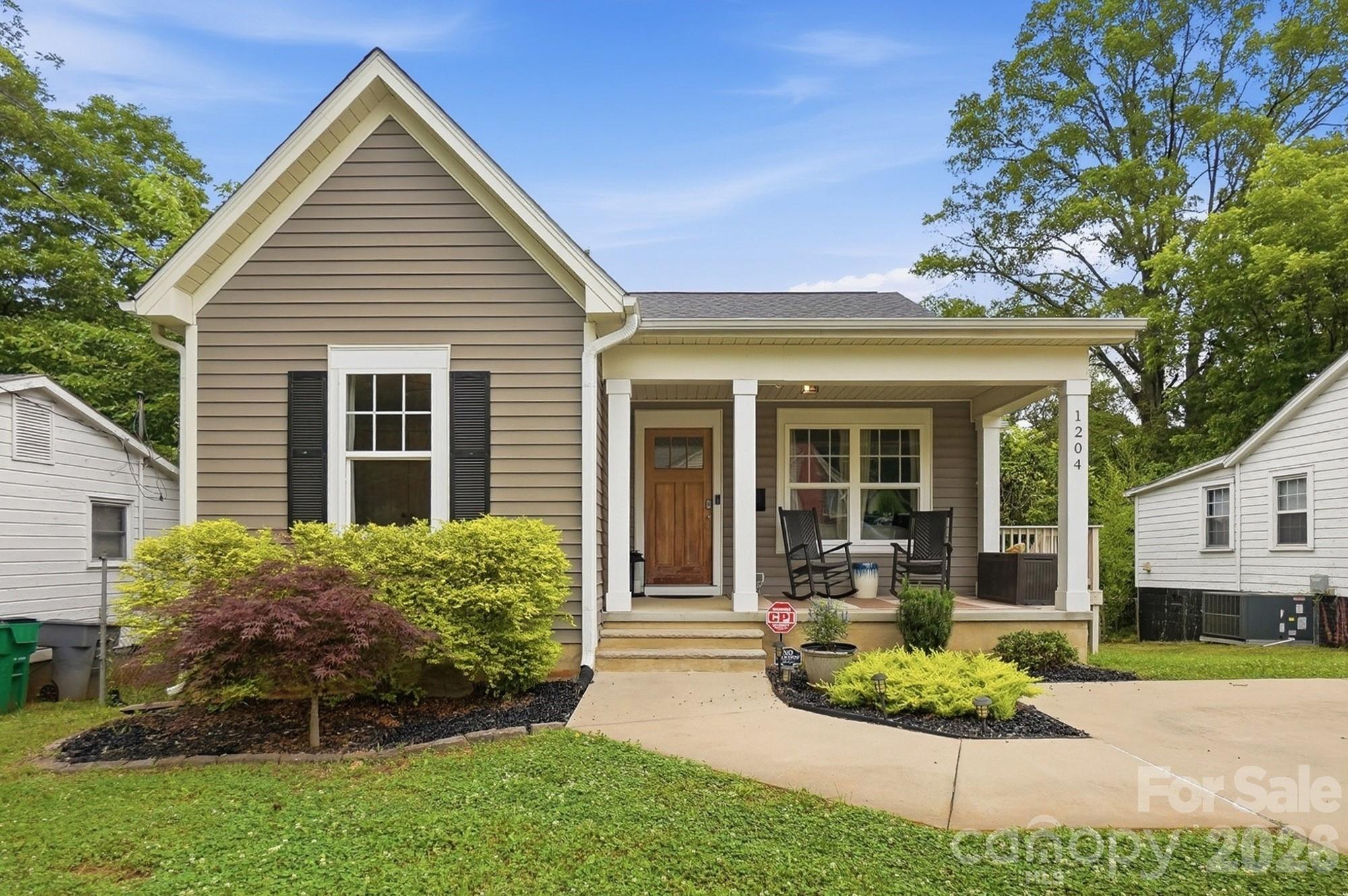 Built in 2017, this well-maintained ranch bungalow is located in a rapidly growing area just minutes from Uptown. As you arrive at 1204 Condon Street, the inviting front porch welcomes you to relax and enjoy the neighborhood charm.

Inside, you'll appreciate the open floor plan and modern conveniences. This home has prefinished wood flooring throughout with the exception of the laundry and baths with tile. NO carpeting! The spacious vaulted great room features a wall of oversized windows overlooking the front and side that flood the home with natural light. The cozy dining area opens to a private deck, perfect for grilling.

The bright white kitchen showcases modern shaker-style cabinetry, stainless appliances, pendent and can lighting, ample storage, and a functional layout designed to inspire your culinary creativity. A generously sized laundry room is conveniently situated near both the kitchen and primary suite.

The desirable split-bedroom floor plan offers privacy and comfort for everyone. Located at the rear of the home, the spacious primary suite features large windows overlooking the expansive backyard, generous closet space, and a spa-like en-suite bath complete with dual vanities, modern cabinetry, and an oversized custom-tiled shower with a frameless glass door.

Toward the front of the home, you'll find two additional bedrooms featuring continuous wood flooring and easy access to a well-appointed full bath with modern finishes.

The sloping lot provides a huge walk-in crawl space offering exceptional storage potential, workshop space, or the opportunity to create a studio or hobby area.

Don't miss this rare opportunity to own a newer home in one of the area's growing neighborhoods.