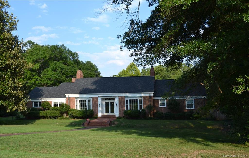Grand 2 door entry into foyer, library w/ built in bookcases and FP. There is a LG FMDR, BRK room w/ cork floor, spacious kitchen, 4 oven AGA stove, island & cork flooring, com fridge /freezer. LG fam & rec room w/carpet & FP, over-look the pool. Enclosed windowed porch with deck overlooking bkyd & a bedroom & full bath. Upper has a grand MB walk-in closet & dressing area, BR & sitting room overlooking the pool & bkyd. Lower: 1 BR w/full bath, mudroom 2 car garage Walk up attic. Seller Motivated
