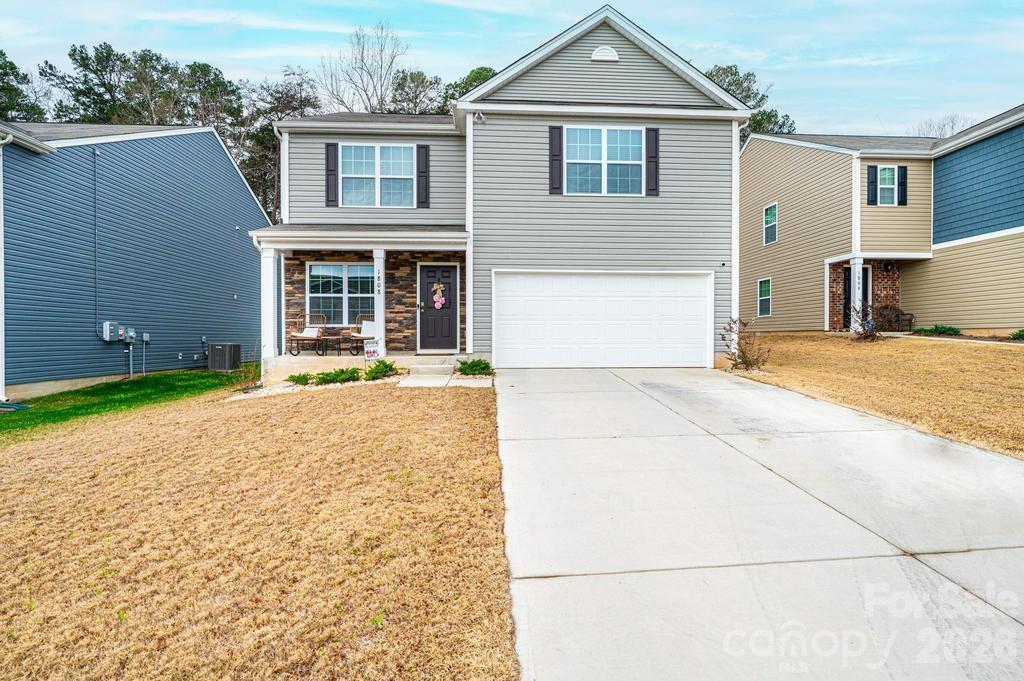 Don’t miss this opportunity! This nearly new 2024-built 4 bedroom, 2 ½ Bath home sits in one of Dallas’ newest communities. Step onto the welcoming front porch and into the spacious living room featuring a cozy fireplace and seamless flow into the dining room. The spacious kitchen is a standout, offering 30” cabinets with crown molding, granite countertops, a pantry, Whirlpool® stainless steel appliances, and a versatile moveable island that stays with the home. A convenient half bath completes the main level. Upstairs, the thoughtful layout continues with a generous primary suite featuring an en-suite bath and walk in closet. Three additional bedrooms, a full bath, and a dedicated laundry room provide comfort and convenience for everyone. This home is equipped with modern smart home features including a programmable thermostat, Z wave door locks and wireless switch, touchscreen control panel, automation platform, video doorbell, Amazon devices, and stylish LED flush mount Maxim Lighting® throughout. Enjoy a two car garage and a level backyard enhanced by a newly added white privacy fence—backing up to wooded views. The Mills at Long Creek offers fantastic amenities: a clubhouse, spacious pool, playground, sidewalks, and easy access to Charlotte, Gastonia, Lincolnton, Hickory and surrounding areas via I 85 and US 321. This home truly has it all—schedule your showing today!