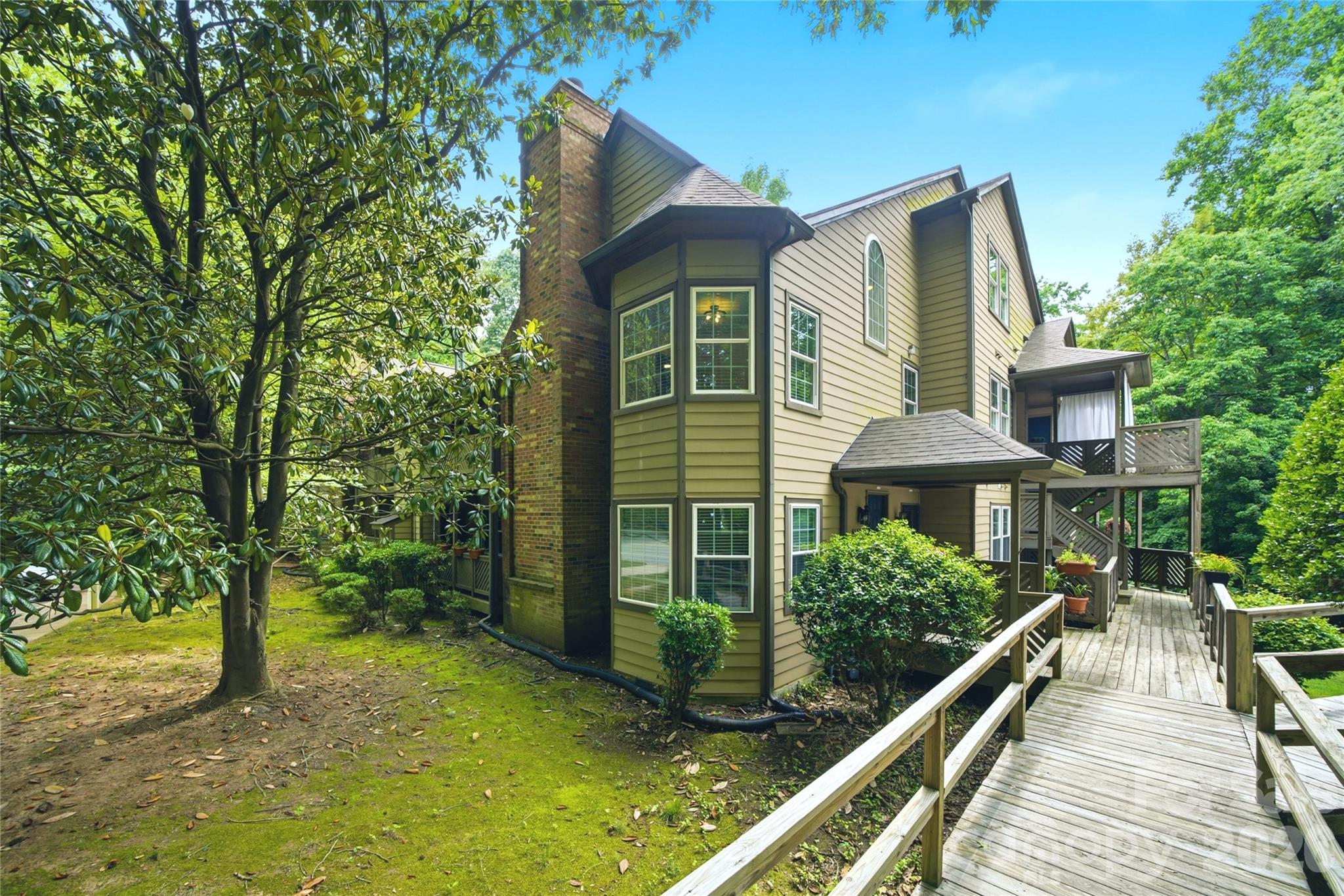 Rare I line floorplan available! Boasting one of the largest floorplans in Bennington Woods, an opportunity to own the I line floorplan in a private tranquil location within the development, offering a rare combination of space, privacy, and direct access to the Little Sugar Creek Greenway in the heart of South Charlotte.

Tucked beneath a canopy of mature trees, this home features a private paved entrance to the Greenway, creating a lifestyle where morning walks, bike rides, and evening strolls become part of your daily routine, minutes from SouthPark, Quail Hollow Country Club, the Light Rail, Uptown Charlotte, premier restaurants, and upscale shopping.

Inside, every detail has been carefully curated to create a home that feels both elevated and welcoming. New engineered hardwood flooring and red oak hardwood stairs (2021) add warmth and character throughout. The kitchen was completely refreshed (2021) with quartz countertops, a deep single-bowl sink, designer faucet, a contemporary backsplash, and a full suite of appliances.

The primary suite upgrades include a luxurious walk-in shower and renovated vanity. The guest bath has also been transformed with a new tub, shower, vanity, and updated fixtures. Custom French glass doors open to a sun-drenched flex space that easily adapts as a home office, reading retreat, exercise room, or creative studio.

Major infrastructure improvements provide peace of mind for years to come, including Google Fiber installation (2024), AquaPEX plumbing replacement (2025), Ring video doorbell and Yale smart keypad entry (2025), refreshed lighting throughout (2021 and 2026), fresh interior paint (2026), and new turf installed on the deck (2026).

Residents enjoy access to a community pool, clubhouse, beautifully maintained grounds, and an active HOA that fosters a genuine sense of community while providing a low-maintenance lifestyle.

Opportunities to own a home of this size, quality, and location within Bennington Woods are exceedingly rare. Combining the community's largest floorplan, extensive improvements, and private Greenway access, this move-in-ready residence delivers an exceptional South Charlotte lifestyle that is difficult to replicate.