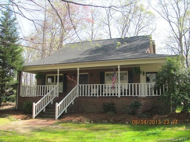 Walk to the golf course from Spring Lake Estates.  This beautiful 3 bedroom/2.5 bath brick home features a masonry fireplace, formal dining room, formal living room, den and sun room.  Master bath features whirlpool tub, separate shower.  Beautiful level wooded lot.  Rocking chair front porch.  Home has been beautifully maintained.  Call today to see this special home.