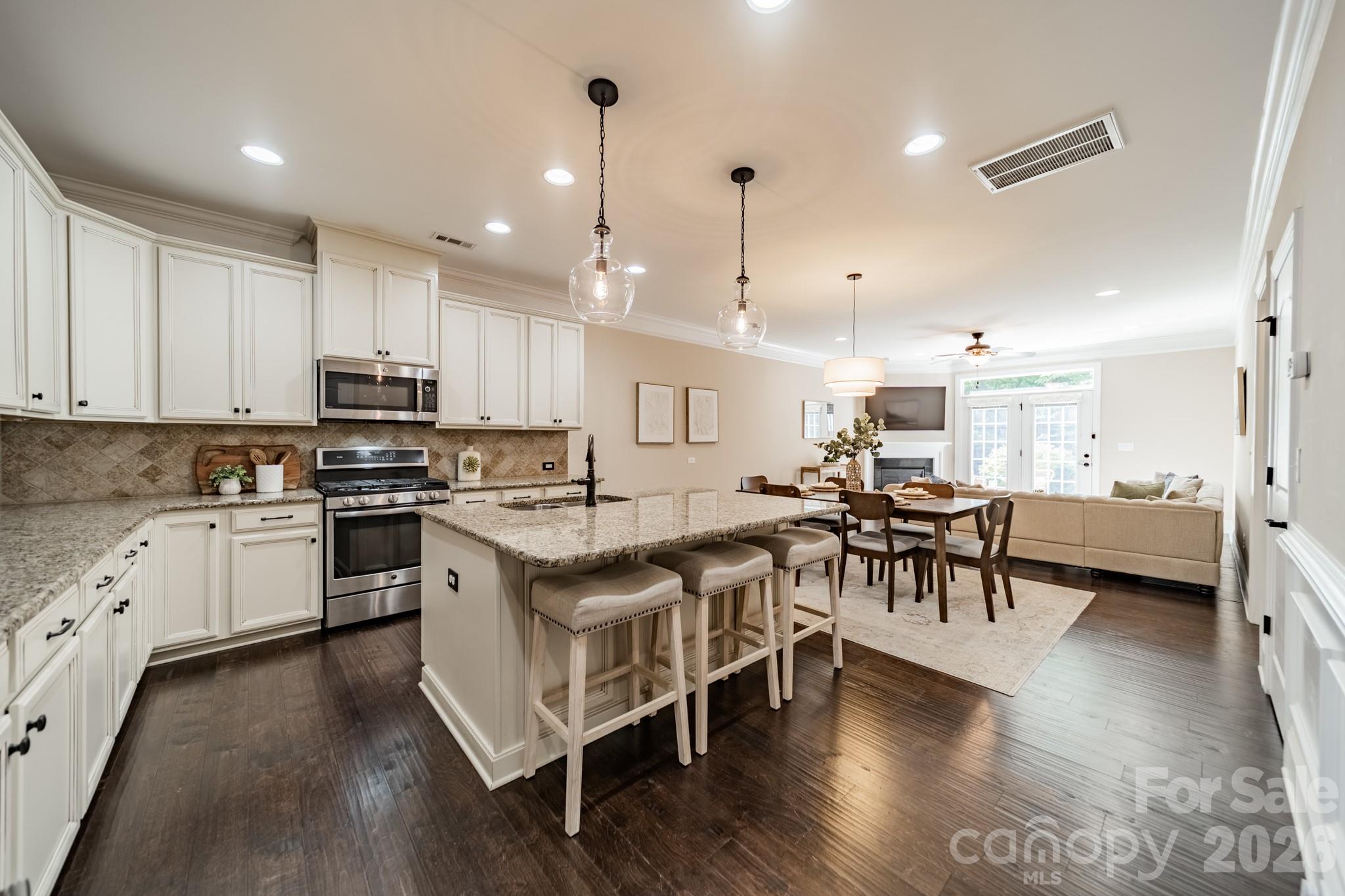 Welcome to easy living in the charming, gated community of Beacon Knoll Villas in Fort Mill! This beautifully designed full brick 3-bedroom, 3.5-bath townhome offers over 2500 square feet of comfortable living space filled with warmth, style, and thoughtful details throughout. The gourmet kitchen is truly the heart of the home, featuring upgraded cabinetry, stainless steel appliances, a gas range, and an oversized kitchen island ideal for gathering over morning coffee or hosting holiday dinners. Just off the kitchen, there is a large dining area, and the inviting living room centers around a cozy gas fireplace, creating the perfect place to unwind at the end of the day.

The primary suite on the main floor provides a private, everyday retreat, complete with a spacious tile shower and a walk-in closet featuring a stackable washer/dryer. Upstairs, two generously sized secondary bedrooms each feature their own private full bath, giving family and guests plenty of space and privacy while looking out onto the secluded backyard. The oversized bonus room adds incredible flexibility and could easily become a media room, game room, playroom, home gym, or office. Walk-in storage and a second laundry room complete the upstairs. Step outside onto the patio and picture summer cookouts and evening cocktails while the private, wooded yard provides an oasis perfect for enjoying the Carolina weather. 

Life in Beacon Knoll Villas also comes with access to wonderful neighborhood amenities, including a pool, hot tub, clubhouse, pickleball, and tennis courts. The community also boasts two large ponds with access for fishing, kayaking, and long scenic walks! Townhome HOA includes yard maintenance. Located just minutes from Baxter Village, Kingsley, and Downtown Fort Mill, you are never far from local restaurants, boutique shopping, local coffee shops, and entertainment, and residents enjoy Fort Mill's award-winning schools, all with easy access to highways I-77 and I-485, making for an easy commute into Charlotte. This is one you will not want to miss! Preferred lender offering a lender incentive up to $4,490! Terms and conditions apply; reach out for more details. Seller is offering an additional $2,000 in seller credits toward rate buy down with acceptable offer!
