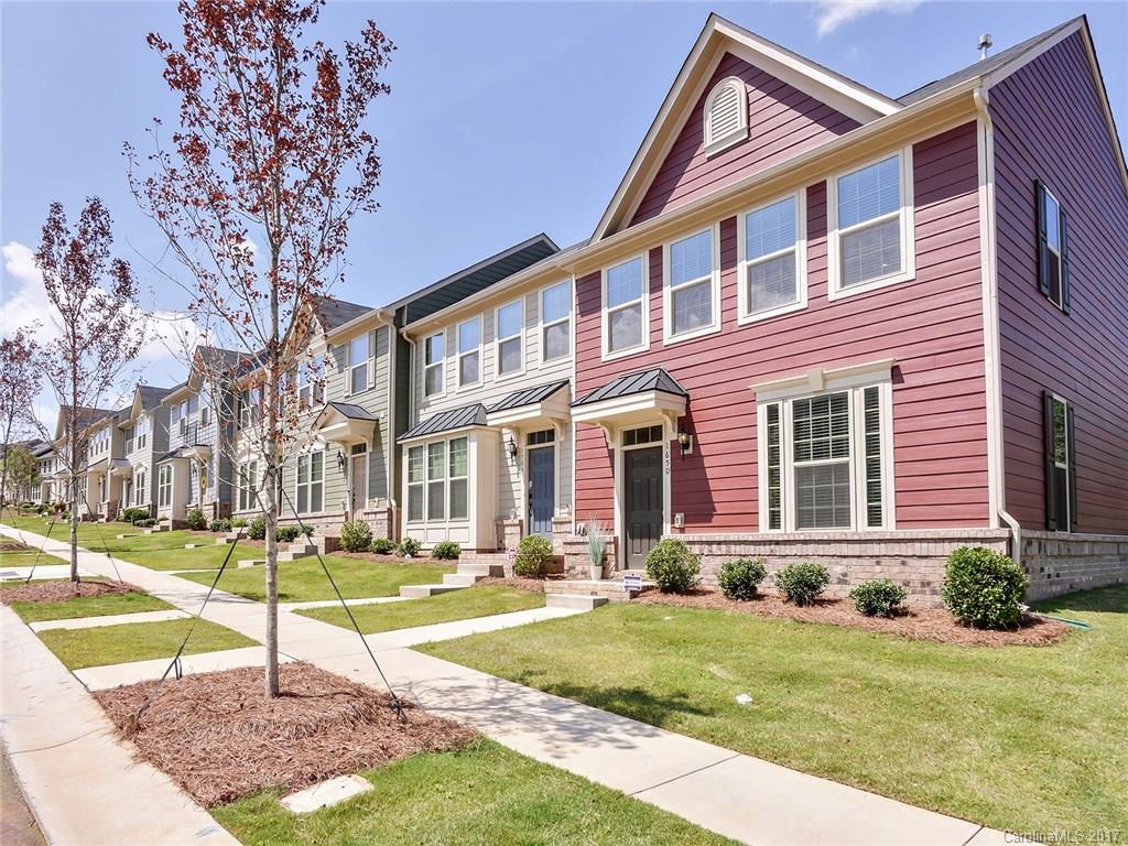Join all the excitement in the emerging Freemore West neighborhood.  Fun eateries, breweries and only 1 mile to Uptown. Walk to Panthers games! This immaculate 1 year young townhome has all of the upgrades. End unit offers beautiful natural light to fill every room and sparkle off Hardwood floors.  Rich Espresso cabinets, SS appliances & granite counters accent the large open kitchen featuring central gathering island.  Join friends for outings to Pinky's, Lucky Dog Bark/Brew and so much more.