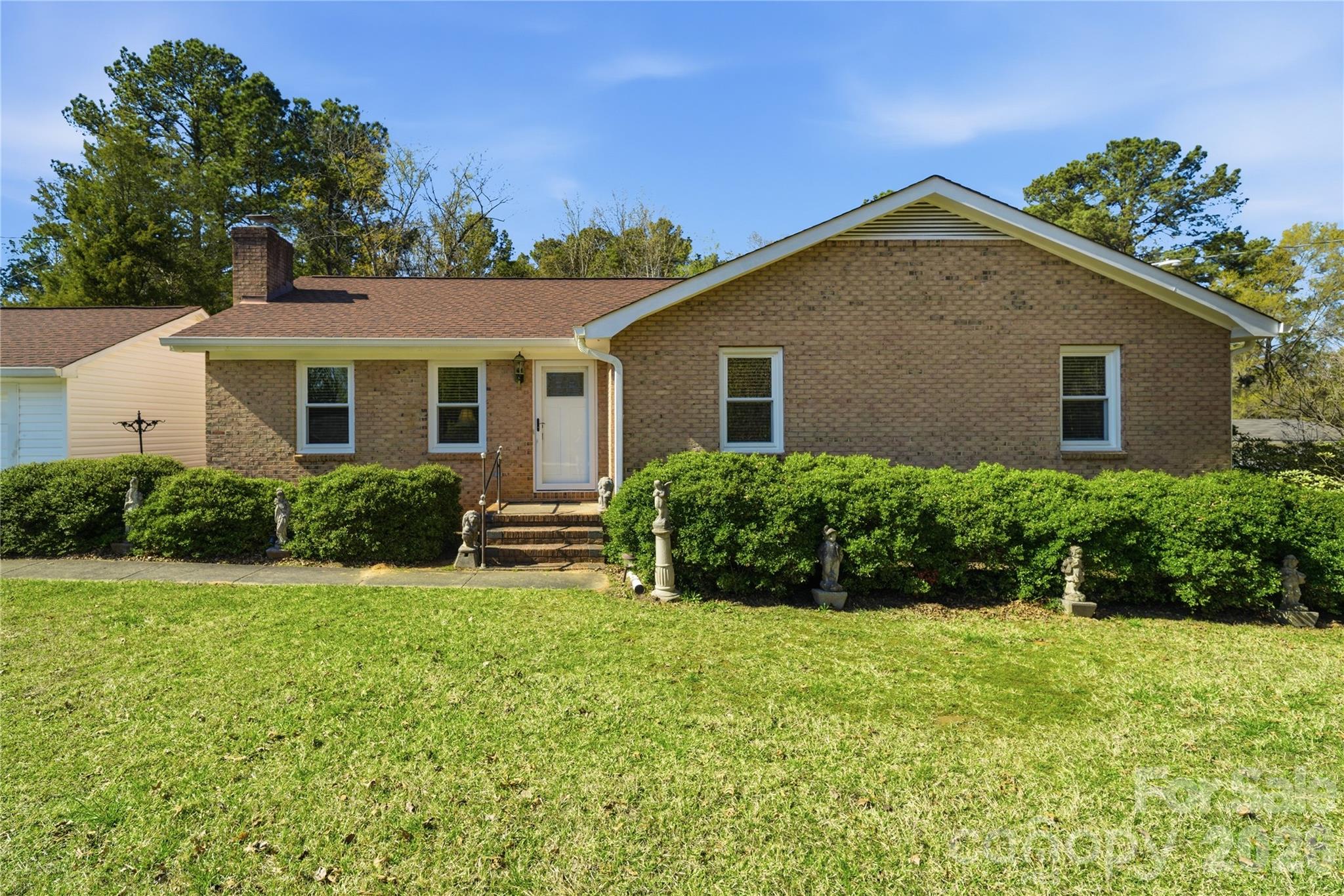 Welcome home to this charming and beautiful brick ranch, perfectly situated on a generous 0.85-acre flat lot in a wonderfully established neighborhood. With 3 bedrooms and 2 full baths, including a comfortable primary suite, this home offers both functionality and warmth in every space. Step inside to find gleaming hardwood floors and a spacious living room ideal for gathering with family or entertaining guests. The updated kitchen features elegant granite countertops, stainless appliances, ample cabinetry, and a layout that makes everyday living and hosting effortless. Outside, you’ll love the wide-open yard—perfect for play, gardening, or hosting outdoor get-togethers. The property offers plenty of parking with a large driveway that easily accommodates four or more vehicles, plus a detached vinyl-sided one-car garage complete with workshop space for hobbies or storage. Enjoy the benefits of well and septic, along with low South Carolina taxes, making this property both practical and affordable. With 1,547 square feet of comfortable living space and a setting surrounded by mature trees and established homes, this property combines privacy, charm, and convenience. Don’t miss your chance to own this inviting home with room to live, grow, and entertain—schedule your showing today!