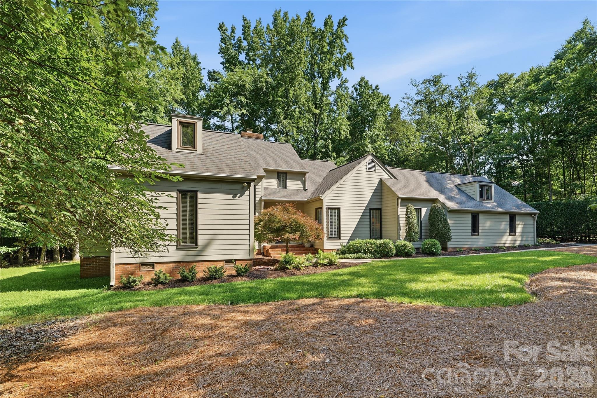 Grab this one before someone else does.  This is the home you have been waiting for!  An immaculate gem nestled on a private, wooded lot in Charlotte's highly desirable Providence Plantation community, this charming two-story home offers the perfect blend of space, character, and comfort. Situated on nearly an acre, the property provides exceptional privacy and room to enjoy spacious outdoor living while remaining conveniently close to shopping, dining, top-rated schools, and major commuter routes. Inside, you'll find a desirable floor plan with 3054 square feet of thoughtfully designed living space featuring 4 bedrooms and 3.5 bathrooms. Warm and inviting living areas, abundant natural light, and timeless architectural details create a welcoming atmosphere throughout. The spacious floor plan offers multiple gathering spaces ideal for both everyday living and entertaining.  The Primary MAIN LEVEL suite provides a peaceful retreat, while generously sized secondary bedrooms on the main and upper level offer flexibility for multi-generational living, guests, or home office needs. Outside, the expansive lot showcases mature trees and ample space for recreation, gardening, or future enhancements.  Located in an established neighborhood in South Charlotte known for its large homesites and beautiful natural surroundings, this property presents a rare opportunity to enjoy privacy, convenience, and classic Charlotte living in one of the area's most sought-after communities. The 2026-2027 CMS School Assignment is now Providence Spring Elementary - Jay M. Robinson Middle School - Providence High School.  Sellers have lovingly maintained their home throughout the years.  See the attached Seller Improvement List.  Don't miss the opportunity to be the new owner of this truly lovely home.  Make an appointment today. You will not be disappointed!