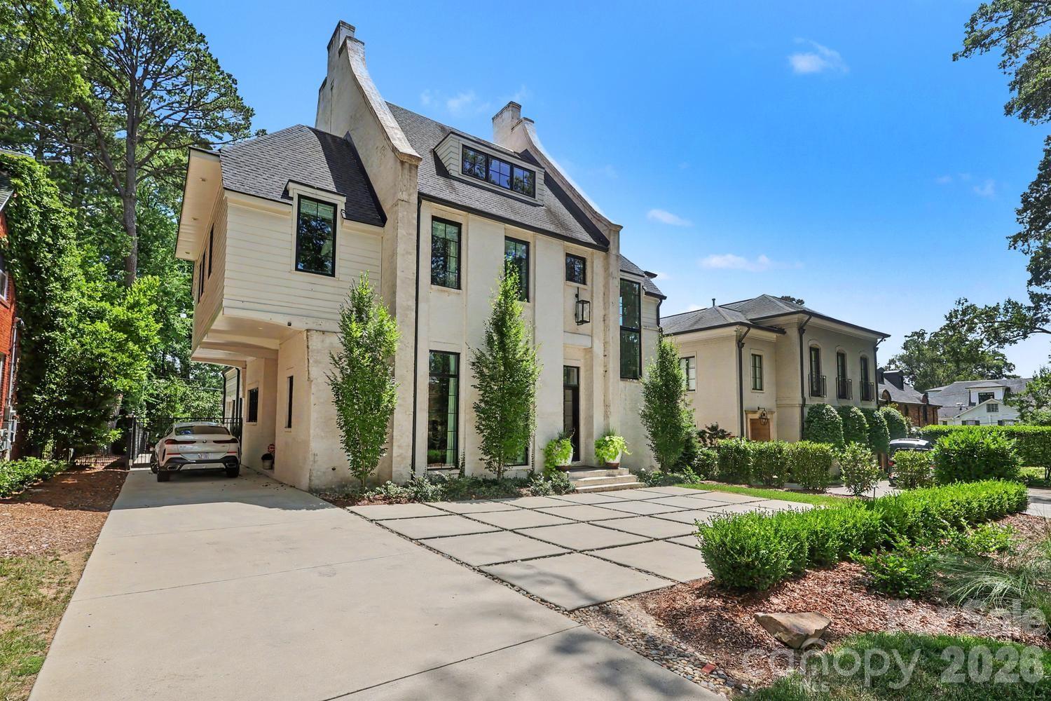 Exceptional European-inspired home in a prime Myers Park location, offering timeless character, quality craftsmanship, soaring ceiling height, and abundant natural light. The open floor plan is ideal for everyday living and entertaining, featuring a luxurious dining room, an updated kitchen with marble countertops and backsplash, a large island, storage, and open views to the family room. A cozy den adjoins the kitchen, while a well-appointed entertaining bar with a wine refrigerator, sink, and dishwasher adds the perfect finishing touch.

Sliding doors open to a private side patio, and French doors lead to a covered porch for seamless indoor-outdoor living. The luxurious primary suite features a new Closets by Design custom walk-in closet, a second walk-in closet, and an expanded laundry room. All 5 bedrooms offer en-suite baths. A private au pair/in-law suite (5th Bd)witch includes a sitting area and a spacious third-floor recreation room provide exceptional flexibility. An outstanding opportunity to enjoy elegant living in one of Myers Park’s most sought-after locations.