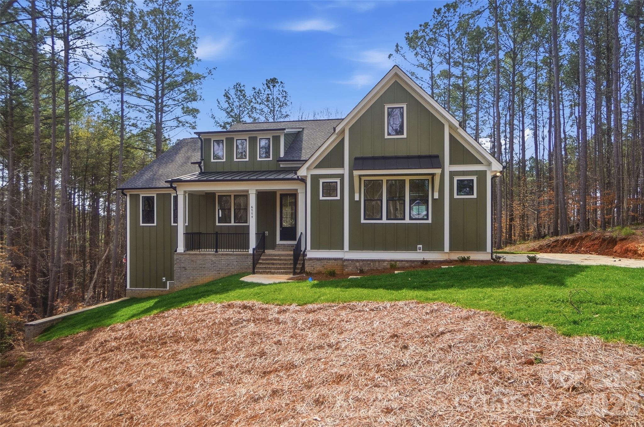 WELCOME HOME to the Gated Community of Harbor Oaks. This Custom home features stunning features throughout! Main floor features pocket office, well-sized laundry room with sink, inviting great room with beautiful views and lots of natural light. OPEN floorplan! 10 Foot Ceilings w/ 8ft Doors on Main Floor.  Kitchen is AMAZING w/black & white shaker cabinets, quartz countertops, tile backsplash, NEW SS Appliance package, HUGE island w/seating & Walk-in Pantry! Primary on main featuring large bedroom & bathroom w/stunning custom tile shower, soaking tub, his/her quartz vanities w/HUGE walk-in closet.  2 additional spacious bedrooms on the main floor. Upstairs is a large bonus/flex space with a full bathroom! BASEMENT: Fully finished basement hosts 1 additional bedroom, kitchenette, living area, storage space, full bath and laundry space. Oversized 2 car garage! 
Home is situated close to the cul-de-sac in the highly sought after Harbor Oaks gated community - no through traffic! Enjoy playground, covered picnic area, & paved hiking trails at Rock Springs Nature Preserve across from Harbor Oaks. Easy access to HWY 16 & 150 to commute to CLT, Mooresville, Hickory.