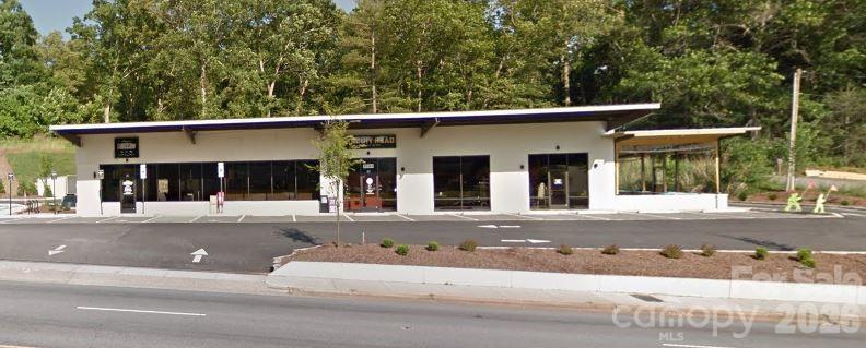 INVESTMENT OPPORTUNITY for a fully leased 2 tenant building directly on Hendersonville Rd.  Tenants are:  Biscuit Head & Studio Chavarria (Barbershop).  Building was completely remodeled in 2018.  Great location, tons of parking and street front signage.  MUST SEE!