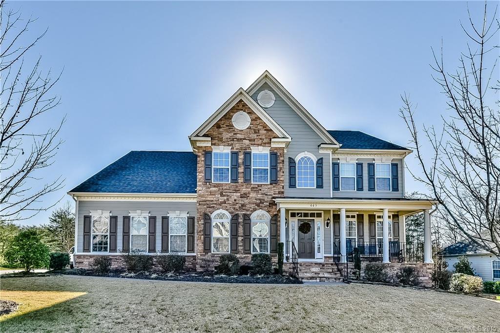 Stunning executive home with open floor plan. 2 story great room. Spacious kitchen with granite & ss appliances. Huge center island & butlers pantry. Bar entertainment area. King size master on main with tiled garden tub & shower. His/Her closets.  Two upstairs bedrooms with jack n jill bath with additional 4th bedroom. Large bonus room. Deck overlooks wooded half acre + lot with stone fire pit. Wide drive 3 car side load garage. Sprinkler system with established landscaping. Tega Cay amenities.
