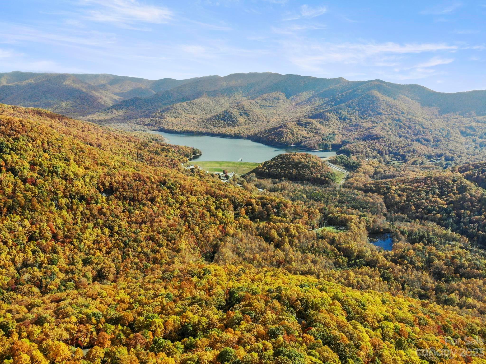 Laurel Ridge is the perfect "mountain retreat" community located in beautiful Black Mountain; Offering spectacular mountain views with a 14 minute drive to the center of Black Mountain; With elevations over 3,000 feet, Laurel Ridge enjoys cooler summers and has a distinct 4 season natural landscape; Build your custom dream home in this scenic, peaceful setting; Enjoy every season while hiking along the stream and creeks throughout the community; Lot provides amazing views of the Asheville watershed surrounded by the Blue Ridge Mountains; Laurel Ridge is a community dedicated to living in harmony with nature; Short term rentals are allowed; New Skyrunner Broadband fiber optic cable is available to provide high speed internet; Community provides:  Water system, underground utilities, Black Mountain Fire Department sub-station, and The Lodge at Laurel Ridge/community center or event space.  See attached "Questions and Answers" for further community and HOA information.