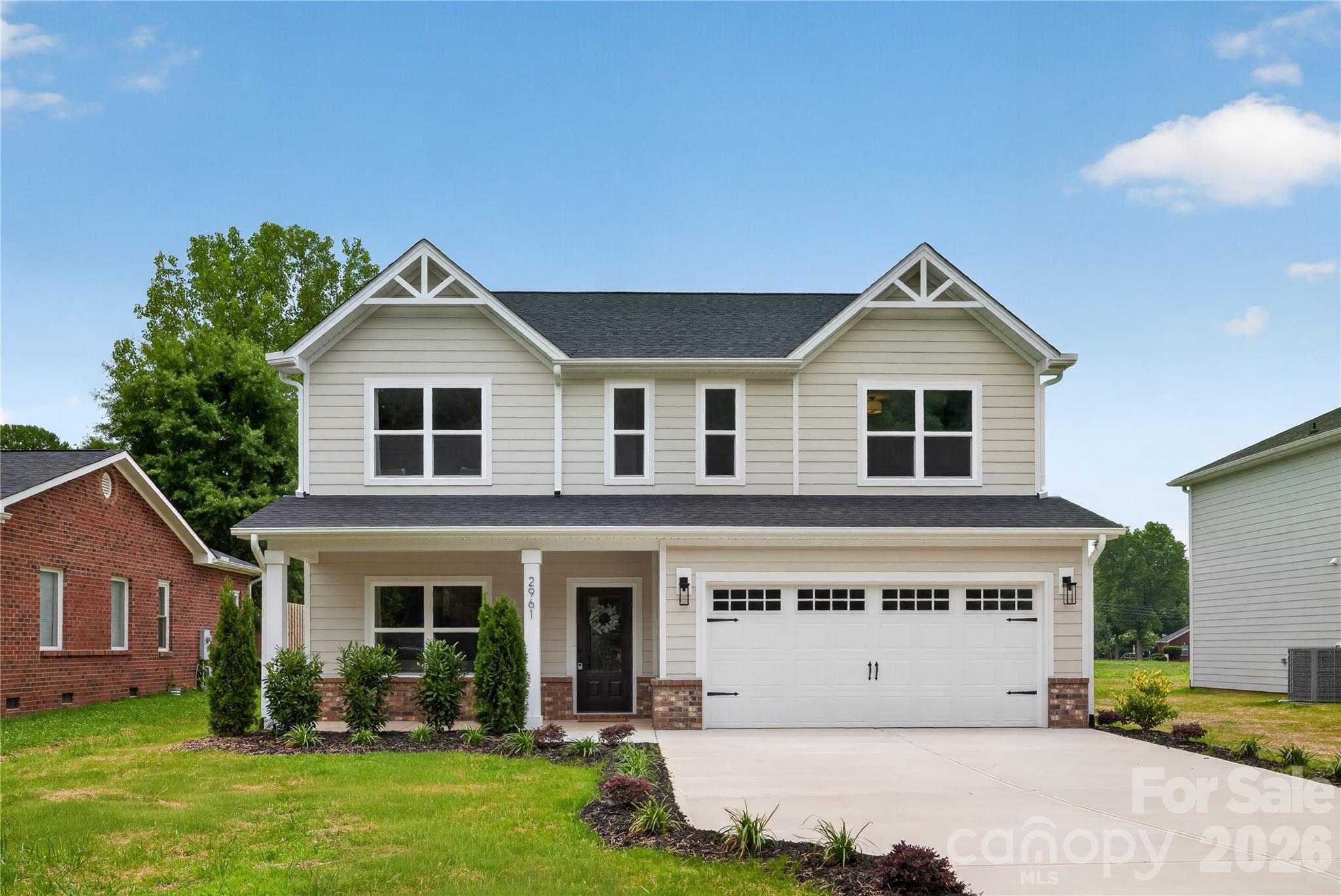 This beautifully crafted new-construction home offers modern living in a convenient north Charlotte location, surrounded by Mallard Creek Park and Tradition Golf Course. The thoughtfully designed open-concept layout seamlessly connects the kitchen, dining, and living areas—ideal for both everyday living and entertaining. The kitchen is equipped with quartz countertops, soft-close cabinetry, and a spacious island that anchors the main living space. The primary suite provides a comfortable retreat with generous closet space and a well-appointed bath, while additional bedrooms offer flexibility for guests, a home office, or future needs. Step outside to enjoy a flat, usable backyard—perfect for entertaining, play, or relaxing evenings. Enjoy close proximity to UNC Charlotte, the light rail, and major commuter routes—schedule your tour today!