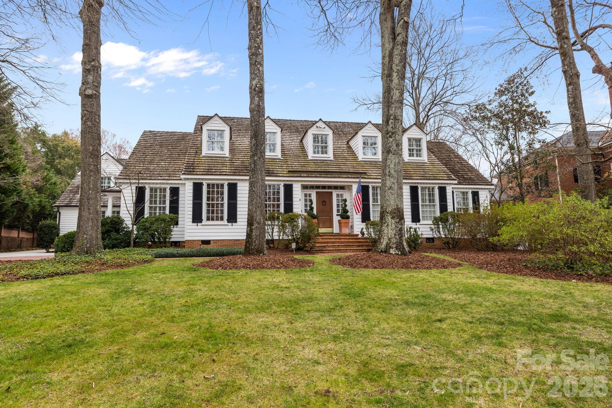 A charming Eastover home renovated and expanded on in 2012 by RT Dooley And Don Duffy. The ground floor is spacious, well lit, and flows exceptionally from room to room. High ceilings down, custom millwork, and hardwood floors throughout. All bedrooms have private baths. First floor primary includes dual baths (one with steam-shower), walk in closet, gas fireplace, and adjoining “true” exercise room (w floating floor) accentuated by views of the backyard and pool/spa. The gleaming kitchen and family room are the heartbeat of the home highlighted by rustic hand-hewn beams, triple celestial windows, and an expansive eat-in island. Ample counter space, cabinetry, walk in pantry, and features such as coffee bar and warming drawer provide a seamless transition through the area. The family room is tied together by a beautiful handmade mantle surrounding a gas fireplace. Other main floor attractions are the guest suite, cypress paneled study, living and dining rooms, office, rec room with bar, powder room, and generous laundry room.
Upstairs are four bedrooms with private baths, walk in attic, and beautiful cedar closet.
Lovely brick enclosed backyard. Mature landscaping, salt water heated lap pool/spa, expansive blue stone terrace with fire pit. Wonderful pavilion with full bath, 2nd washer-dryer, bar and grill, complete with lounge area. Spacious 3-car garage and storage area. Flex room above with full bath, kitchenette, and temperature controlled wine room. Additionally the main houser is supported by a whole house water purification system, multiple tankless water heaters, and a 35KW whole house generator.