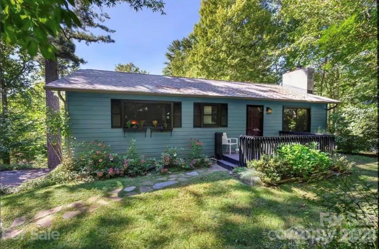 Back on Market at no fault of the property.

Investors take notice—this property boasts rental history for the past four years and is ideally located just five minutes from the proposed Advent Medical Hospital off 25/70. Offering the perfect balance of privacy, nature, and convenience, this home sits close to both downtown Weaverville and Asheville.

Upstairs, you’ll find Andersen windows, vaulted ceilings, and abundant natural light that create a warm, inviting atmosphere. Hardwood floors run through the bedrooms, and the updated kitchen features butcher block countertops, a classic subway tile backsplash, and durable tile flooring. Cozy gas fireplaces on both the main level and downstairs add charm and ambiance throughout the home.

The primary suite includes new wood floors, double closets, and an ensuite bathroom. A second bedroom offers a private sliding door leading directly to the back deck, perfect for enjoying the outdoors.

The finished lower level expands your options with a den, full bathroom, gas fireplace, and a Murphy bed, making it ideal for a studio, guest suite, or separate living space. Major updates include a roof installed in 2017 and HVAC in 2018.

Step outside to enjoy a tiered deck and a large, fenced yard, ideal for entertaining, pets, or simply relaxing in a peaceful setting. Whether you’re looking for a primary residence, investment opportunity, or flexible live-work space, this home checks all the boxes.