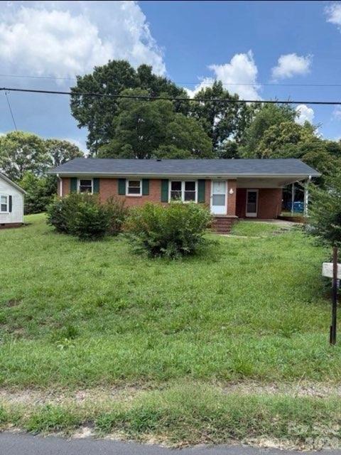 Charming and full of potential, this 3-bedroom, 1-bath brick home in Kannapolis offers a great opportunity for investors or future homeowners alike! Featuring beautiful hardwood floors, spacious living areas, and a backyard with a detached storage building; this home blends classic character with functional touches. Enjoy a covered carport and a convenient location close to shopping, dining, and downtown Kannapolis amenities. Roof was replaced in 2017 per the seller. Water heater replaced in 2020. Laundry location is in the carport closet. Tenant-occupied property with a lease in place through August 31, 2026, providing immediate rental income potential. Property photos are from before the current tenants move-in date (08/2025)
