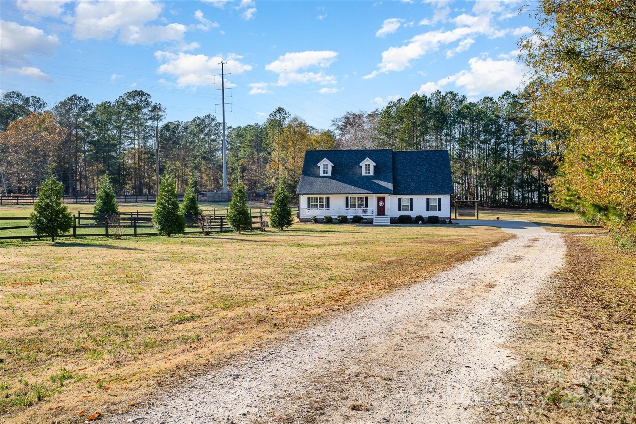Absolutely stunning 3/2 Ranch home with oversized bonus room on 2.22 acres! This home is nestled away from the road, surrounded by established trees, ensuring privacy & tranquility. The spacious and functional floor plan features a large, open family room that connects to a great sized eat-in kitchen with granite countertops, perfect for gatherings & entertaining. The large primary bedroom has an en-suite bath for a luxurious retreat with dual vanity sinks & tiled walk in shower. Enjoy the expansive bonus room above the garage, ideal for a home office, game room, or additional living space. High-quality finishes throughout include hardwood floors in the living areas, tile in the baths and laundry & granite counters. Step outside to the covered back porch where you can grill & unwind in your private, spacious yard. Come enjoy all that this home has to offer including no HOA fees and no city taxes. Conveniently located- near hwy 55 & 557, minutes from downtown, schools, and restaurants.