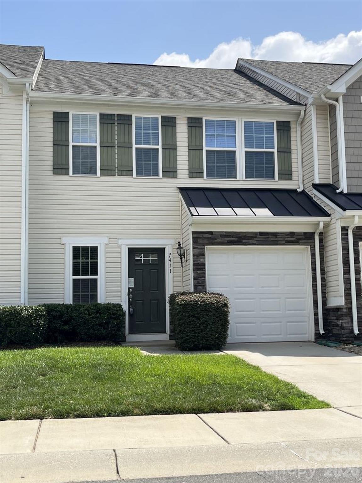 Fantastic 2 story townhome in gated community!  This ready to go home features 2 primary style bedrooms each with their own full bathrooms and walk in closets.  The main floor has an open living room, dining area and great size kitchen with island, stainless appliances and granite counters.  Half bath on main level and large storage closet.  Upstairs has the bedrooms and laundry room.  Large, semi-private rear patio overlooking common area.  The home also has a 1 car garage and driveway parking.  Community has clubhouse, fitness center and pool!  Great location with access to shopping, dining and entertainment.  Close to I-485 and easy commute to Charlotte Airport, Uptown, Ballantyne and Fort Mill SC.  Don't miss this one!
