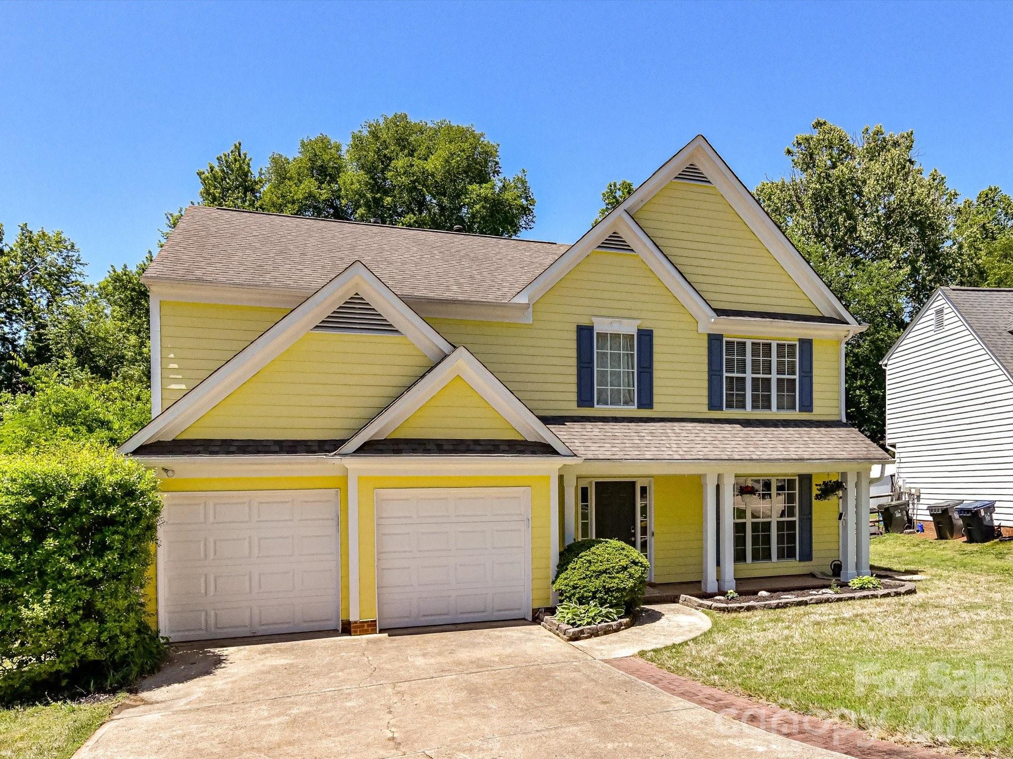 This home offers a functional layout with space for everyday living and entertaining. The main level features a formal living room with built-in shelving, a dining room, and a kitchen with adjoining breakfast area that opens to the family room with a fireplace and feature wall. Upstairs, the primary suite includes a walk-in closet and ensuite bath with dual vanities, garden tub, and separate shower. Three additional bedrooms, a second full bath, and a laundry room with linen closet complete the upper level. Outside, enjoy a flat backyard with a patio, wood deck, and storage shed with covered porch.