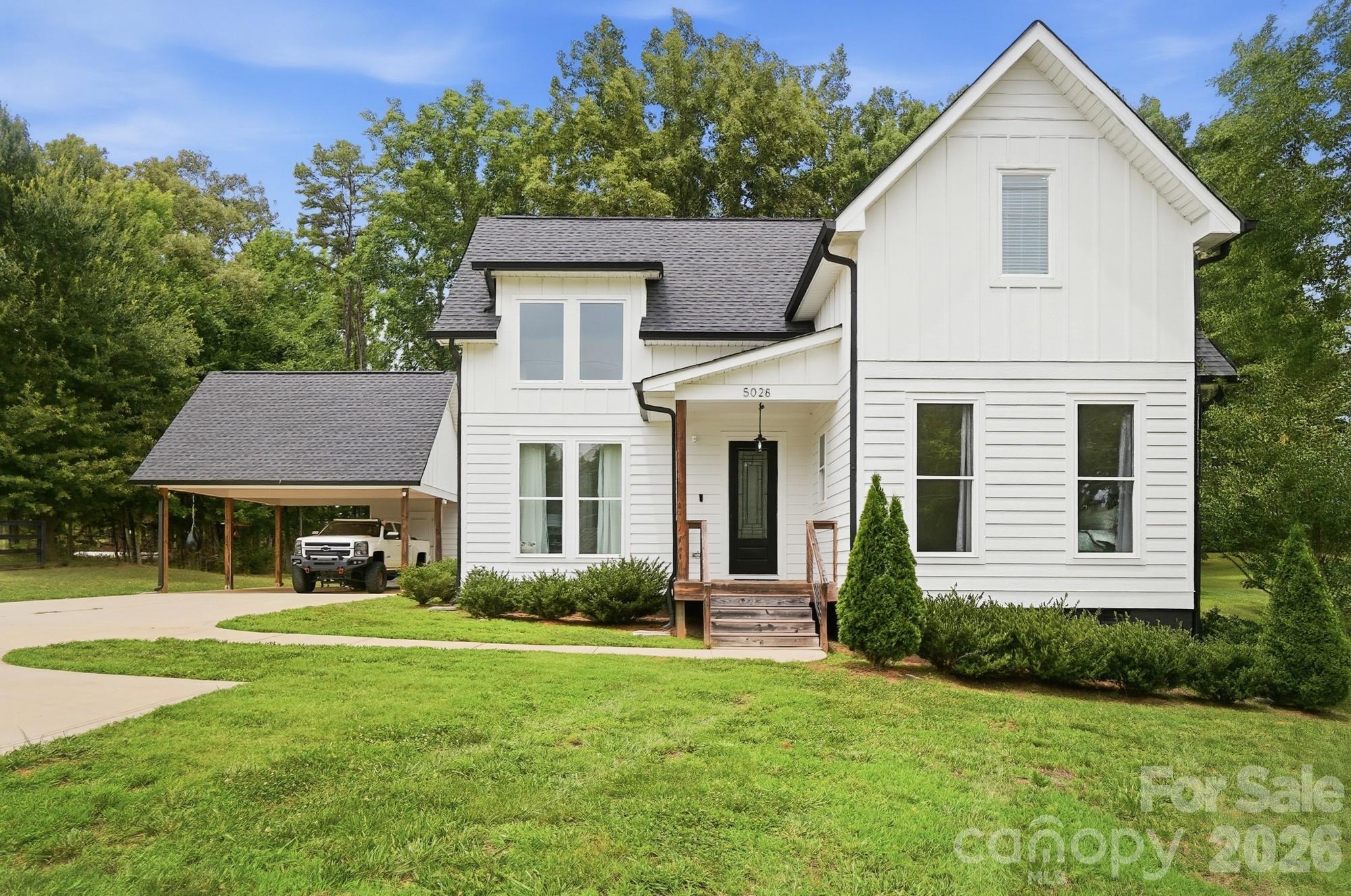 Your Land. Your Lifestyle. Your Freedom. Welcome to this custom-built modern farmhouse where space, privacy, and freedom come together on almost full acre in southwest Gastonia. Built in 2021, this beautifully designed 3-bedroom, 2.5-bath home offers 2,058 square feet of thoughtfully crafted living space with no HOA and room for the lifestyle you’ve been looking for. Step inside to an open two-story great room filled with natural light, a spacious kitchen featuring quartz countertops, and modern farmhouse finishes throughout. Large rear windows frame peaceful views of mature trees, creating a seamless connection between the indoors and outdoors. Outside, enjoy your covered back deck overlooking a private backyard with established trees and a neighboring horse pasture that adds to the tranquil setting. The oversized driveway offers plenty of space for your boat, trailer, or multiple vehicles—without HOA restrictions. Perfectly positioned for outdoor enthusiasts, you’re just minutes from Crowders Mountain State Park and a short drive to Lake Wylie, the U.S. National Whitewater Center, golf courses, parks, dining, and all the conveniences of Gastonia, while remaining approximately 40 minutes from Uptown Charlotte.

If you’re searching for more than just another subdivision home, this property delivers something increasingly hard to find—land, privacy, character, and the freedom to truly make it your own.
