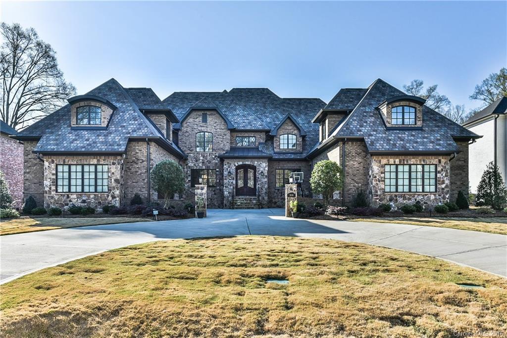Spectacular custom home w/impressive 1st floor master suite-heated floors,gas fireplace,generous master bath,oversized steam shower,double vanity,soaking tub & large closets.Exercise suite,sauna,office,formal dining room,2 story stunning foyer,laundry room,guest suite all on main.High ceilings,energy efficiency&hickory hardwoods.Chef's kitchen opens to great room and breakfast area.Covered rear patio, outdoor kitchen,heated saltwater pool,hot tub,fire pit,torches,andseparate pool bath.3 car gar.
