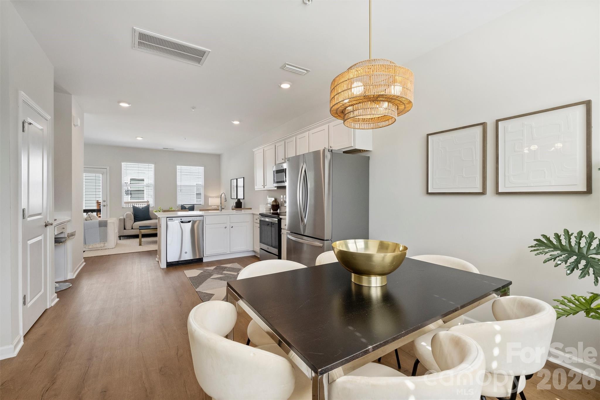 This move-in-ready 2-bed, 2.5-bath townhome offers stylish, low-maintenance living in one of Charlotte’s most sought-after and rapidly growing areas. Tucked between Country Club Heights and Windsor Park with quick access to Uptown, Plaza Midwood, and NoDa, you’re surrounded by some of the city’s best restaurants, coffee shops, live music, and local favorites just minutes from your door. Prefer the outdoors? Nearby Kilborne Park and Evergreen Nature Preserve offer walking trails, green space, and disc golf for an easy escape from the city buzz.

Part of the intimate Vela Grove enclave, this thoughtfully refreshed townhome pairs sleek, modern finishes with functional space in a location that stands out—especially at this price point. In an area where finding a home under $400K with this level of finish, square footage, and garage parking is increasingly rare, this townhome offers exceptional value without compromise. The open-concept layout is ideal for entertaining, working from home, or simply relaxing in style. Need extra flexibility? The lower-level bonus space makes the perfect home office, gym, or creative studio. Plus, the 2-car tandem garage provides the convenience of private parking and extra storage—another hard-to-find feature in this location.

Leave the car in the garage and enjoy city living with room to breathe. Ask about available financing incentives!