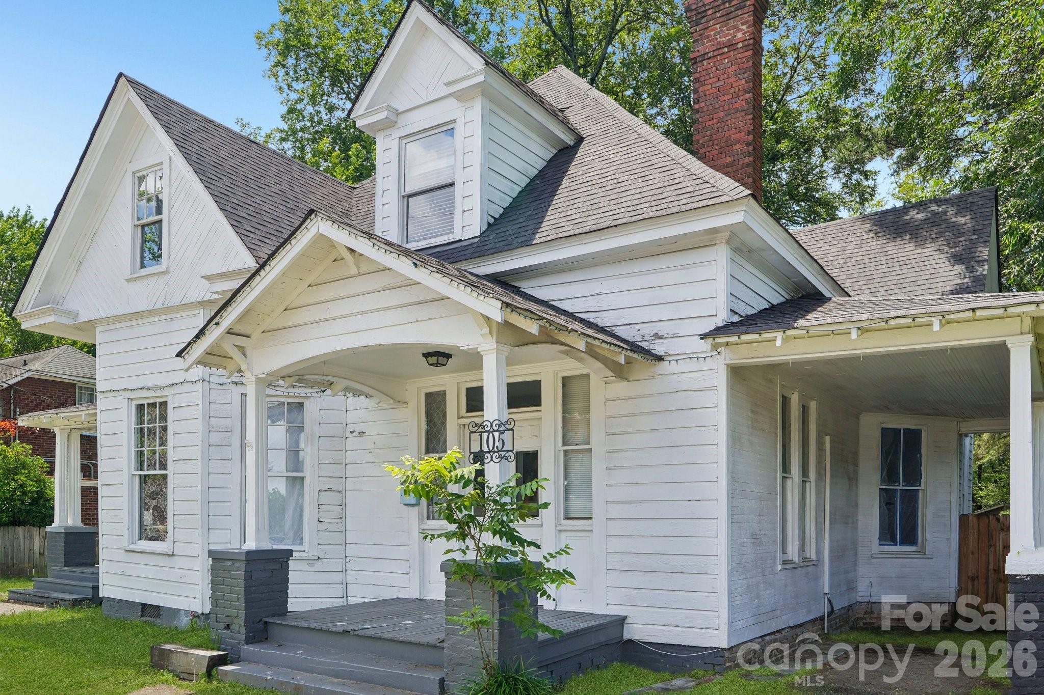 Are you ready to write the next chapter of this historic Monroe gem? Located in the Historic District of Monroe, this charming 4-bedroom, 2-bathroom home is brimming with character and opportunity. Previously a duplex, it’s ready to become a spacious single-family retreat. The inviting covered front porch, original glass doorknobs, mantels, and high ceilings create timeless charm, while large windows bathe the home in natural light. Inside, flexible living areas, generously sized bedrooms, and space for a kitchen remodel await your vision. Outside, enjoy a fenced yard, a covered carport, and eye-catching curb appeal. Plus, you’re just a stroll from Monroe’s shops and dining, making this a rare opportunity! Grass in photos has been digitally enhanced/improved for illustrative purposes.