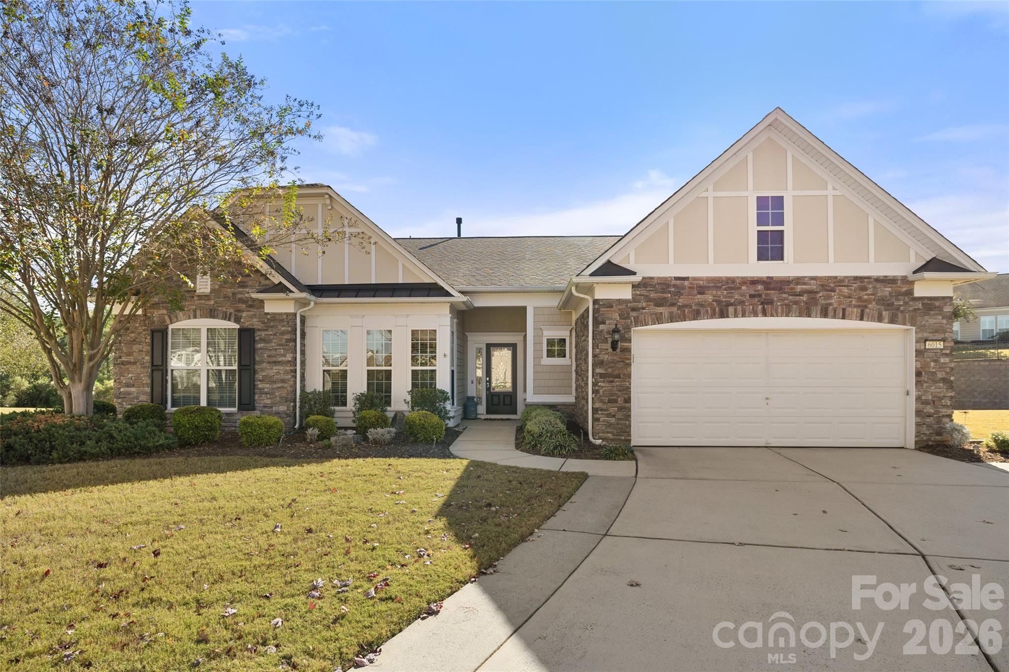 Experience the best of Sun City Carolina Lakes in this impeccably maintained home. The interior is finished with a neutral color palette, faux wood blinds, and a spacious, open floor plan.

The highlight of this residence is the massive, window-wrapped sunroom. This bright, versatile space serves as the home's focal point, offering panoramic views and a seamless connection to the main living area. The gourmet kitchen is fully equipped with granite countertops, tile backsplash, stainless steel appliances, a vent hood, and a wall oven with microwave.

The primary suite offers a peaceful retreat with tray ceilings and a private bath featuring both a walk-in shower and a soaking tub. For added utility, the large laundry room includes built-in cabinets, a laundry sink, and the washer and dryer to convey.

Living here grants access to premier amenities: two amenity centers, 18 holes of golf, pickleball, and trails along the Catawba River. This home perfectly combines high-end upgrades with the vibrant, social lifestyle of Indian Land’s top 55+ community.