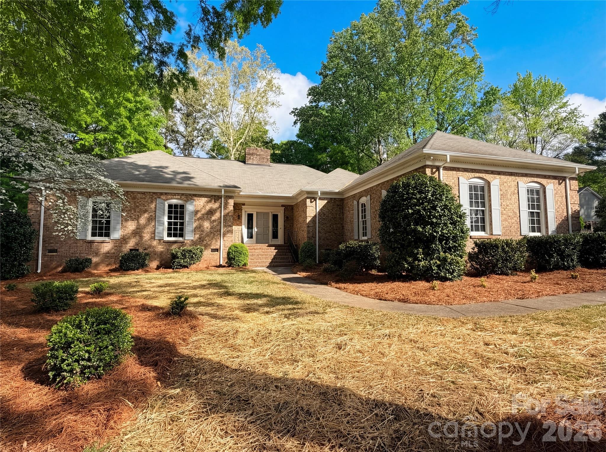 Welcome home to this stunning 3-bedroom, 2.5-bath all-brick ranch that perfectly blends timeless charm with modern comfort. From the moment you arrive, you’ll be captivated by the mature trees and inviting curb appeal. Step inside to a beautiful foyer that opens into a spacious floorplan featuring tall ceilings and great-sized rooms throughout. The cozy living area showcases a gorgeous stone fireplace, creating the perfect focal point for relaxing or entertaining. Enjoy outdoor living on the large back deck or unwind on the side porch, both offering peaceful views and plenty of space to gather. This home truly has it all—character, space, and a layout designed for easy living.