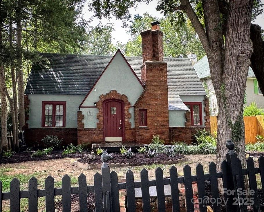 Welcome to your fairy tale. This English Tudor exudes old-world character and charm with a touch modern finishes. Situated in the highly sought-after and historic Montford neighborhood, it presents an ideal opportunity for individuals seeking to personalize this historic home. 

The property boasts several interior updates including addition of LVP flooring on main level, ceiling treatments, custom closet barn doors, a smart thermostat, a new tankless hot water heater (installed in 2025), updated plumbing for bathrooms on the main level and basement, and a new privacy fence in the backyard.  Home has original hardwoods under the LVP flooring that could be refinished. 

With rental history for both the main level and the basement studio apartment, this property could serve as a lucrative income source for investors or a desirable home for individuals ready to invest in their permanent residence.  The basement studio apartment remodel is not yet finished, providing you the opportunity to complete it with your preferences.
