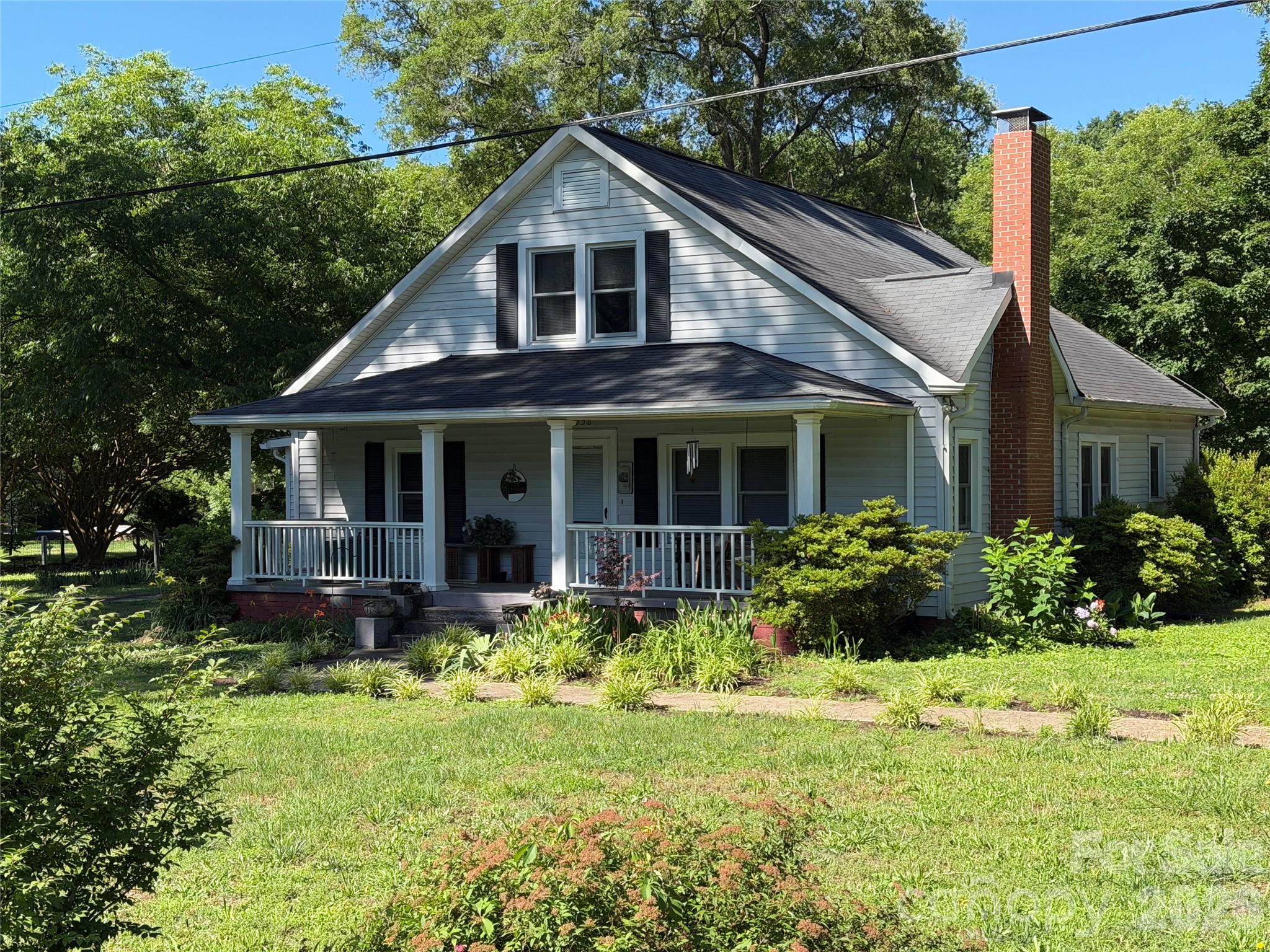 Paradise awaits, everything you need and want in the city limits.  Great built home with covered porches.  Almost 3 acres, with additional sheds and nice shop building on this estate.  Hardwoods in home with farm house feel, comfy and cozy with fireplace and good living.  Enough room to have cows, huge garden area already fenced in.  Newer windows and AC, nice cozy home with lots of room to grow the family. 

Call LA for showing, must accompany showing.