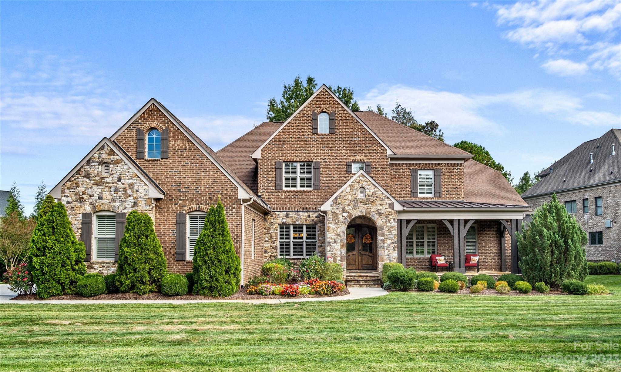 This Gorgeous, meticulously maintained home in gated Longview Country Club showcases an impressive floorplan with the primary suite & desirable guest bedroom on the main floor. Owners have done many updates including custom closets in the primary, epoxy flooring & custom cabinets in the garage as well as custom cabinetry in the upstairs office/media room & main floor laundry. New dishwasher and tankless water heater as well as new sewer and water lines.  AC units are all in tip top shape. The gourmet kitchen opens to an inviting keeping room with vaulted ceilings with wooden beams & stone fireplace. The oversized primary suite has access to the rear screened porch. Upstairs, discover a bonus room, office/media room, a second laundry room, & three bedrooms. Plantation shutters throughout. The serene front covered & rear porches are great spaces to relax.  Excellent schools, low taxes, & convenient access to shops & dining enhance the allure of this residence. Social membership required.