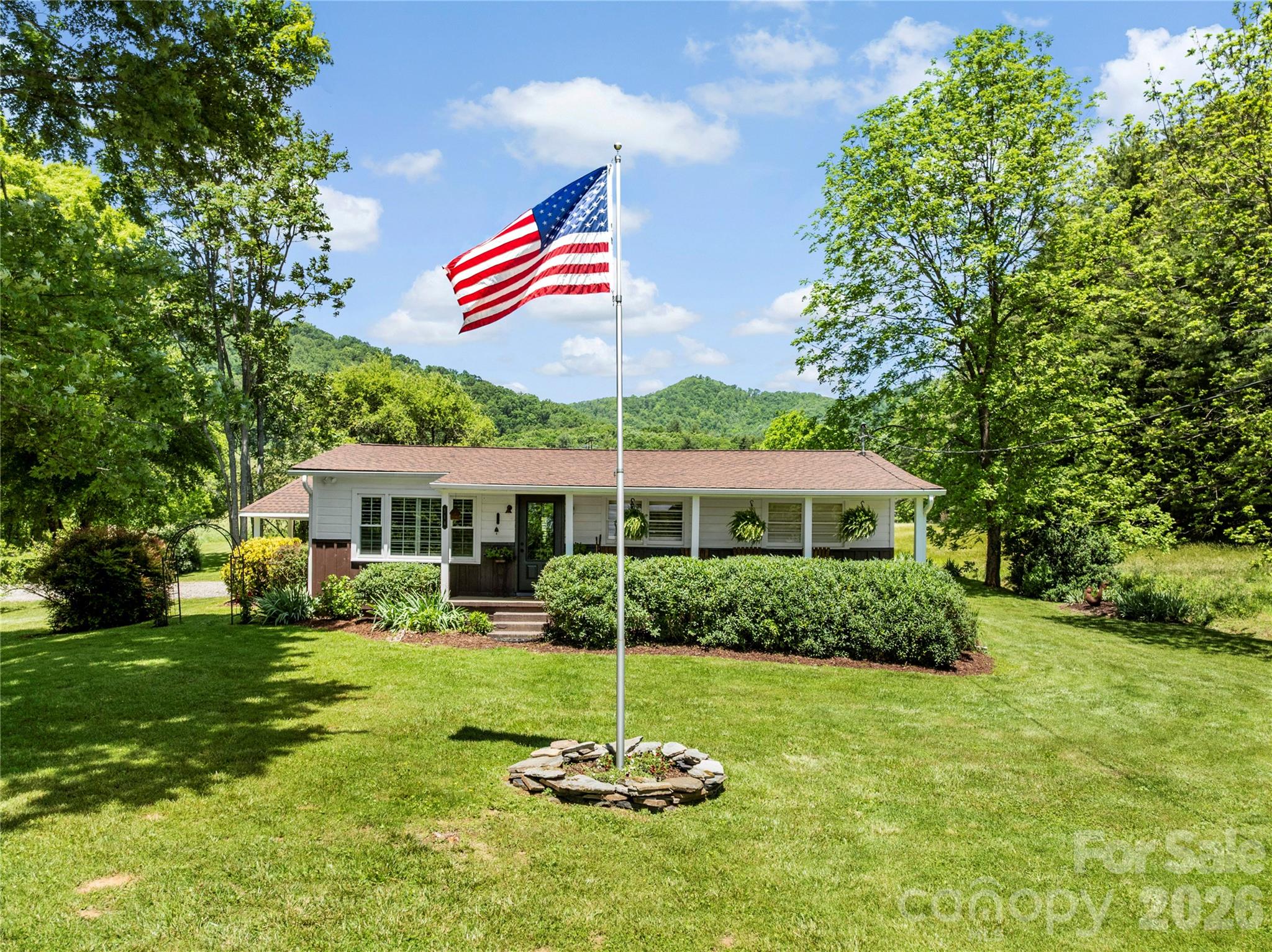 Nestled on 10 beautiful acres in a charming college town, this well-maintained ranch-style home offers the perfect balance of peaceful country living and convenient access—just 20 minutes to Asheville and 10 minutes to Marshall, and only 3 miles from I-26. 

The property is ideal for horses, farming, or gardening, with a serene setting surrounded by the natural beauty of Western North Carolina. Enjoy close proximity to the Blue Ridge Parkway, Appalachian Trail, skiing, golf, and whitewater rafting—making this an exceptional opportunity for outdoor enthusiasts.

The home features numerous thoughtful upgrades, including a new roof (2020), a beautifully remodeled kitchen (2025) with quartz countertops and stainless-steel appliances (gas range, refrigerator, microwave), and an updated bathroom (2024). Additional improvements include an encapsulated crawl space with foundation inspection (2025), a whole-home Generac generator, and a well installed in 2021.

Inside, you’ll find heart of pine floors, slate tile, solid wood interior doors, and plantation shutters throughout, creating a warm and timeless feel. Outdoor living is a highlight, featuring a spacious deck perfect for entertaining, along with a gazebo, hot tub, firepit, and outdoor shower. A natural spring on the property provides an additional water source for the home alongside the well.

An outbuilding with electricity and a large front porch adds even more versatility and charm to this unique property. 

A Home for you! A place where you can create memories, host family, friends and build community relationships!