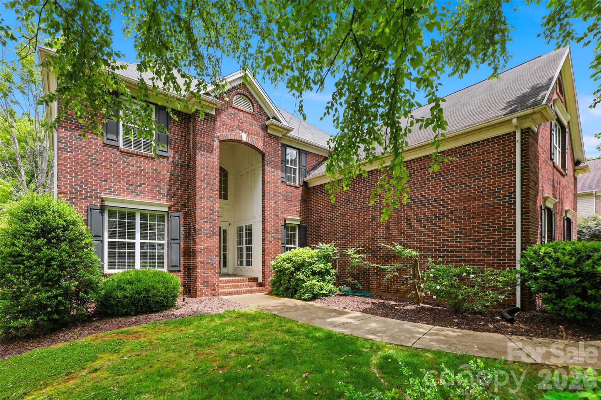 Situated in the sought-after Highland Creek community, this beautifully appointed 4 bedroom/3 bath home offers a thoughtfully designed floor plan with fresh carpeting, interior paint and elegant finishes throughout. Guests are welcomed by a light-filled two-story foyer, flanked by a formal dining room featuring crown molding and chair railing. Just beyond, a main-level bedroom and full bath provide ideal flexibility for guests or a home office.

The heart of the home unfolds into a dramatic two-story living room, filled with natural light from expansive windows and seamlessly connected to the open-concept living spaces. The kitchen is both stylish and functional, showcasing 42-inch cabinetry, granite countertops, a center island, breakfast bar, tile backsplash and stainless steel appliances including a glass-top range with double ovens, microwave, dishwasher and refrigerator. The kitchen opens to the great room, complete with custom built-ins and a gas fireplace, making this the perfect space for everyday living and entertaining.

From the great room, you can access the screened porch with ceiling fan, which extends to a rear deck overlooking the backyard, offering you an inviting setting for outdoor relaxation.

Upstairs, the spacious owner’s suite is a private retreat featuring double doors, decorative molding and a luxurious en-suite bath with dual split vanities, frameless shower, jetted tub and a walk-in closet. The upper level also includes a vaulted-ceiling bonus room with attic access for additional storage, a laundry room and two additional bedrooms that share a full bath.

This home combines timeless design, generous living spaces and comfort in one of the area’s most desirable neighborhoods with so many amenties including  Cabana, Club House, Fitness Center, Golf Course, 4 Outdoor Pools, Pickleball, Picnic Area, Playground, Pond, Recreation Area, Sidewalks, Sport Court, Street Lights, Tennis Court(s), Walking Trails