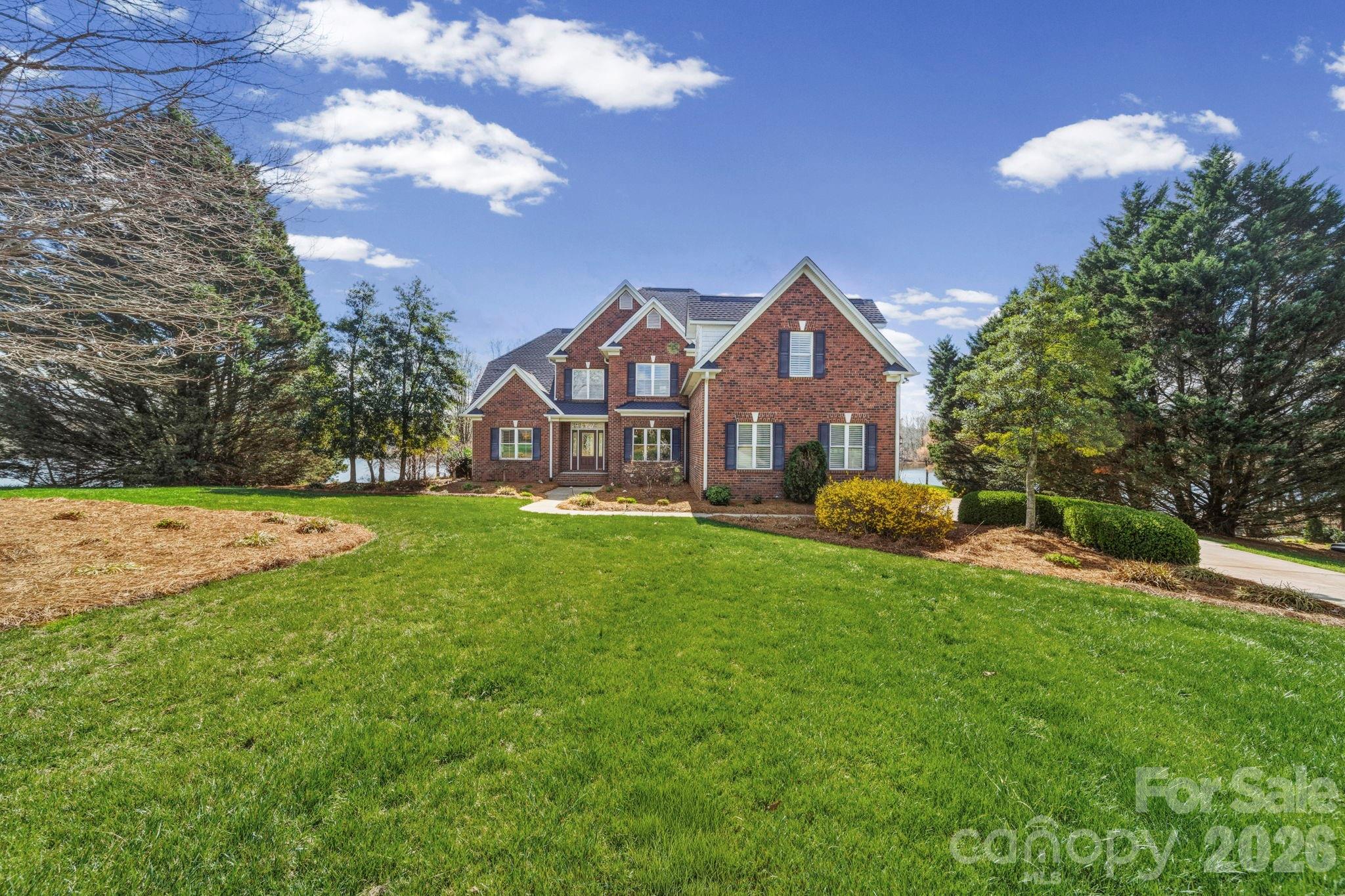 Luxurious living on the Lake!  Stunning home on a most impressive 1.24 acre waterfront lot boasting panoramic views of Lake Twitty with floating dock.  Two story great room with fireplace overlooks the lake seamlessly flowing into a chef's dream kitchen.  The kitchen boasts exquisite cabinetry, granite countertops and fabulous backsplash in addition to large center island and a breakfast bar.  Hardwood flooring throughout most of the main level with carpet in the primary bedroom also on the main level.  An ensuite primary with separate vanities, large whirlpool soaking tub, separate shower and huge walk in closet.  The primary opens up to your own reclusive sunroom with fantastic lake views.  Formal dining room filled with natural light, adjacent is an office on main level, as well as laundry room with ample cabinetry and utility sink.  Upstairs, you will find a 2nd primary with bath, two additional bedrooms and guest bath.  The bonus offers a great space for working or flex space.  Down the hallway another flex space for exercise, gathering, etc.  An expansive and inviting deck provides great entertaining with lake views to enjoy!  Boating, fishing and canoeing await.  This wonderful custom built home sits quietly on a cul-de-sac lot.  Close proximity to shopping, restaurants.  Two miles to Monroe Expressway providing ease in commute to Charlotte and surrounding area.  Move in ready, make your appointment today!!