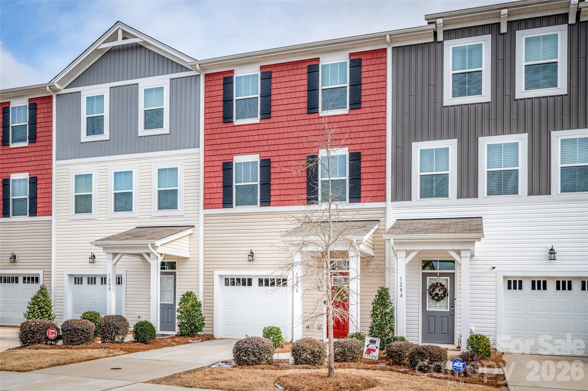 Welcome home to this beautifully designed, like-new, 3-story townhome offering upscale finishes, flexible living spaces, and low-maintenance convenience - perfect for today's lifestyle. The main level welcomes you with a spacious foyer and a versatile flex room that can easily serve as a bedroom, home office, or additional living space complete w/half bath and access to the backyard patio - perfect for relaxing or entertaining. The second floor showcases a bright, open layout ideal for everyday living and hosting. Enjoy the generous great room with private balcony, an expansive dining area and a gourmet kitchen featuring granite countertops, an oversized center island, stainless steel appliances, a pantry and abundant cabinetry for storage and functionality. Retreat to the third floor where you’ll find the well-appointed owner’s suite complete with a walk-in closet and a private ensuite bath featuring a double vanity and walk-in-shower. Two additional bedrooms, a full hall bathroom and a conveniently located laundry area complete this level. Residents of the community enjoy a carefree lifestyle with included lawn care and access to exceptional nearby amenities including the world-class U.S. National Whitewater Center offering endless outdoor recreation. Shopping, dining, parks and entertainment are just minutes away, with easy access to major commuter routes.