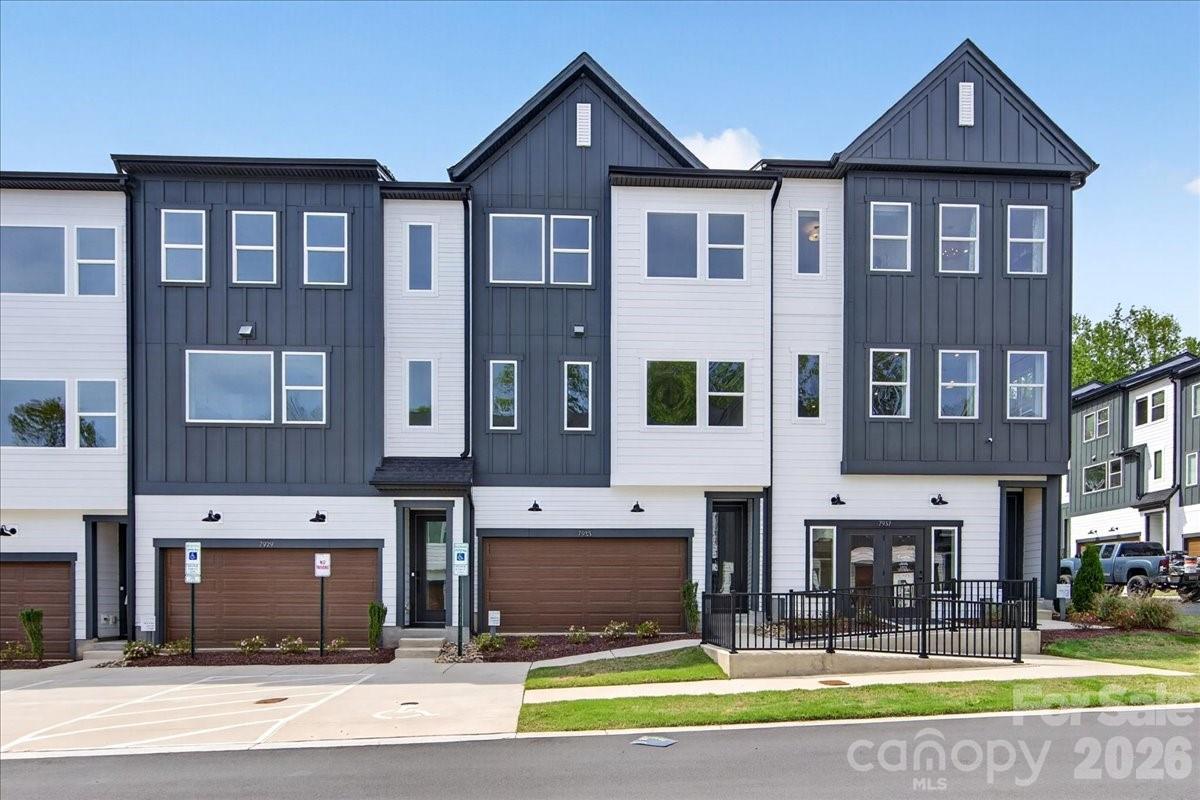 7933 Cedarsmith Ct is the Beau plan model home at Archer Row, a stunning showcase of modern design and elevated finishes in Charlotte, NC, just minutes from I-77, the airport, and Uptown. Oak box stairs with open rails and metal vertical balusters set the tone, while a first-floor flex space with a full bathroom adds everyday versatility alongside a drop zone for seamless organization. The gourmet kitchen impresses with dark brown cabinetry, white quartz countertops, a Delta Essa Touch faucet, a GE 36" electric cooktop with direct vent, and a 4x12 Mythology Santorini undulated white backsplash that adds an artful finishing touch. Two outdoor living spaces, including a covered first-floor patio and a second-floor retreat behind a dramatic 12-foot wide sliding glass door, make entertaining effortless, while the light-filled primary suite with a walk-in closet, dual vanity, and tiled walk-in shower delivers the comfort to match. A community dog park and easy access to everything Charlotte has to offer make Archer Row a lifestyle as connected as it is comfortable.