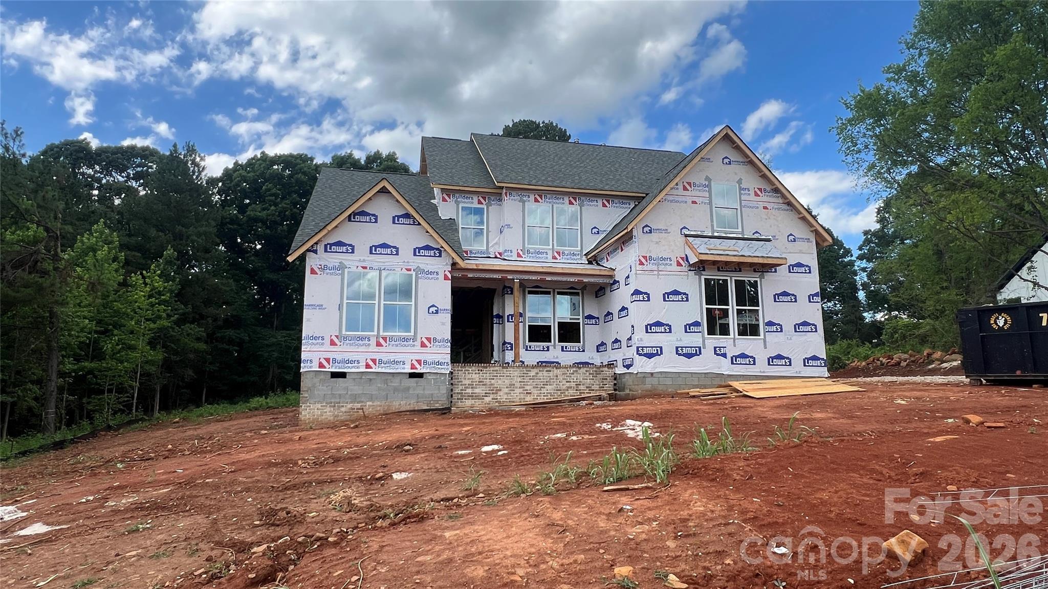 NEW CONSTRUCTION!!! Welcome to Edmunds Farm!!! Huge 1+ acre homesite!!! Peaceful country setting with all the conveniences just minutes away!! You will love all the features in this well appointed NEW home. Stunning Modern Farmhouse elevation with metal detail and stone. 3 Car Garage!!  All the most sought after features like gourmet kitchen with large island, built in ss appliances. Quartz countertops in kitchen and all baths. Wide plank laminate hardwoods throughout the main level and Primary Bedroom. Downstairs Vaulted Primary Bedroom boasts large bath with freestanding tub and huge tile built shower with seamless glass enclosure and a large walk-in closet. Upstairs has 3 Bedroom, 2 full Baths, Loft and a Bonus Room!! Great entertaining on your back covered deck over looking your massive back yard with hardwood trees at the back.