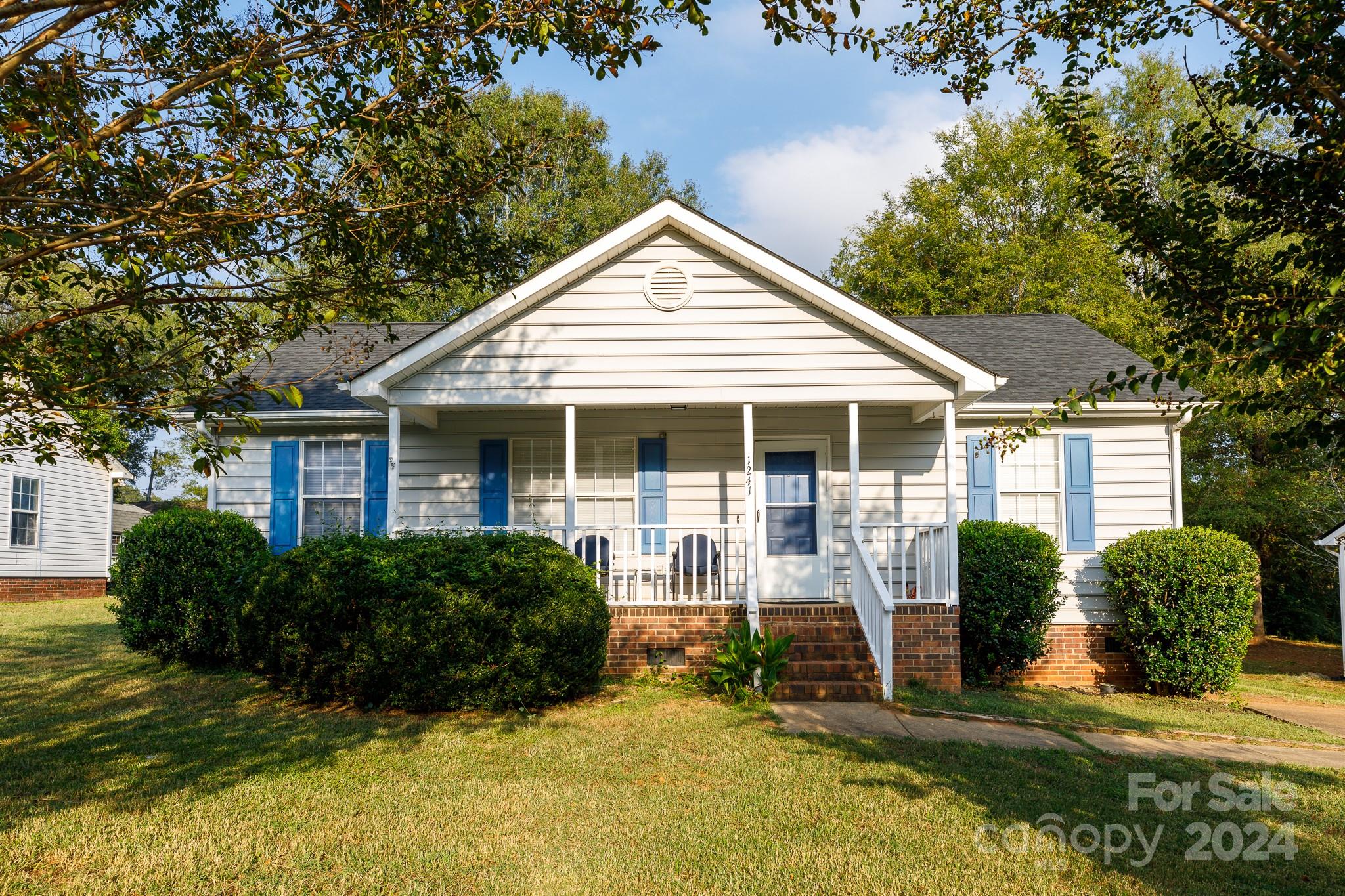 Welcome to this darling one-story that has been well maintained.  Relax with a cup of coffee on your covered front porch or enjoy grilling out on the large back deck with a great view of the back yard. This home features a split bedroom plan with new carpet, floor covering and is freshly painted. Enjoy peace of mind knowing that there is a brand new roof.  Add in all the activities, dining and shopping opportunities around this gem and you will know why this one should be the one you make your Home! Back on the market throgh no fault of the Seller.
