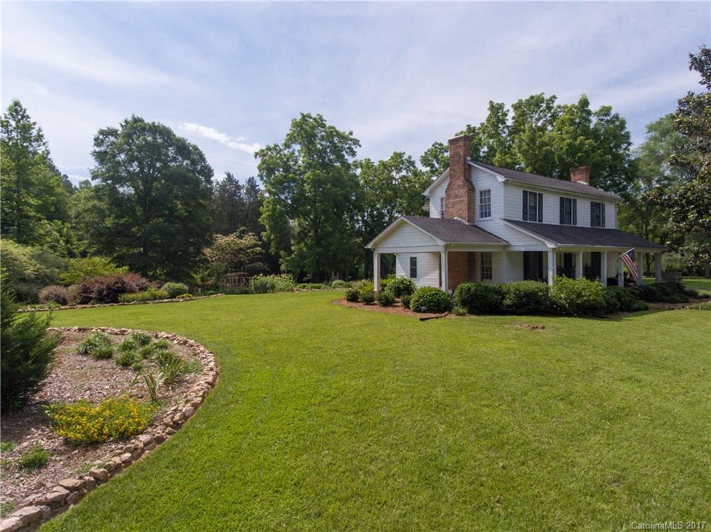 Welcome to country living at its absolute finest. This beautiful home boasts all the sweet Southern charm you could ever dream of with the gorgeous updates you've been searching for. Enjoy formal living and dining rooms set off an incredible kitchen with fantastic storage. Stunning hardwoods span across the main level, including the master, filled with natural light. With five fireplaces, a garden picked right out of a magazine, and 5 acres of your own, you'll be vacationing right here at home.