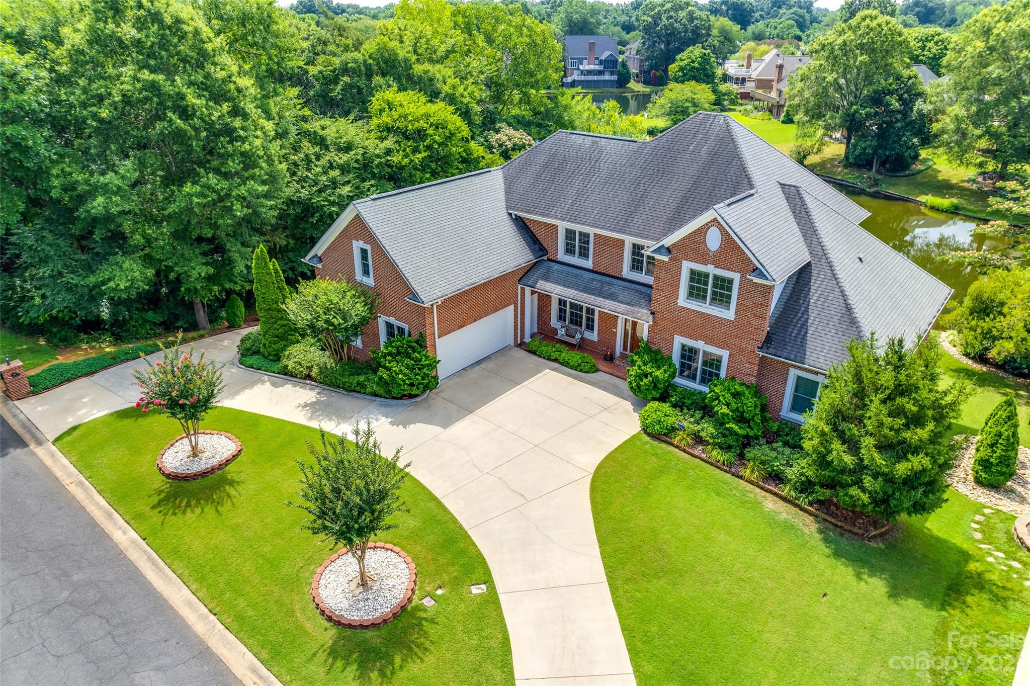 Nestled within the charming, well-established Bailiwyck community, Fort Mill, SC, awaits a remarkable opportunity-a multi-generational home where 2 families can seamlessly coexist. This property boasts 2 separate, complete living areas, each with a 2-car garage w/separate access, & two kitchens, where cooking becomes an art shared between generations. No need to worry about laundry piling up, as this home showcases not one, but 2 laundry rooms. From each level, the breathtaking water view of the serene pond is mesmerizing; imagine waking up every morning to the tranquil sight. With ample living & storage space to accommodate both families comfortably, each member will find solace within their own private sanctuary while still fostering a strong sense of togetherness throughout this splendid residence. Community features include a pool, clubhouse & tennis courts. The era of multi-generational living has arrived at its pinnacle within these walls – it's time for you to make it your own!