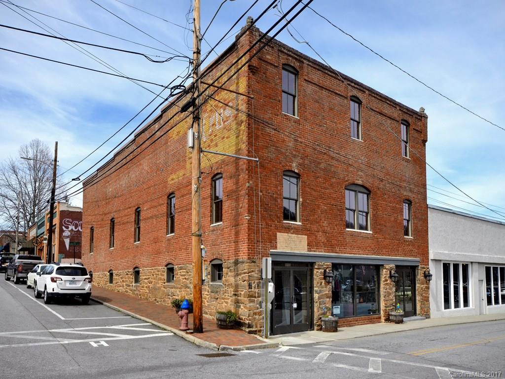Downtown Black Mountain.  Retail opportunity.  Historic renovation offering all new mechanical, plumbing, insulated roof, windows and storefront.  Unique open space features original stone wall interior and wood windows.  Architectural features of original carriage house preserved. Can be leased with upper level fronting Cherry Street. Owner is licensed North Carolina Real Estate Broker.
